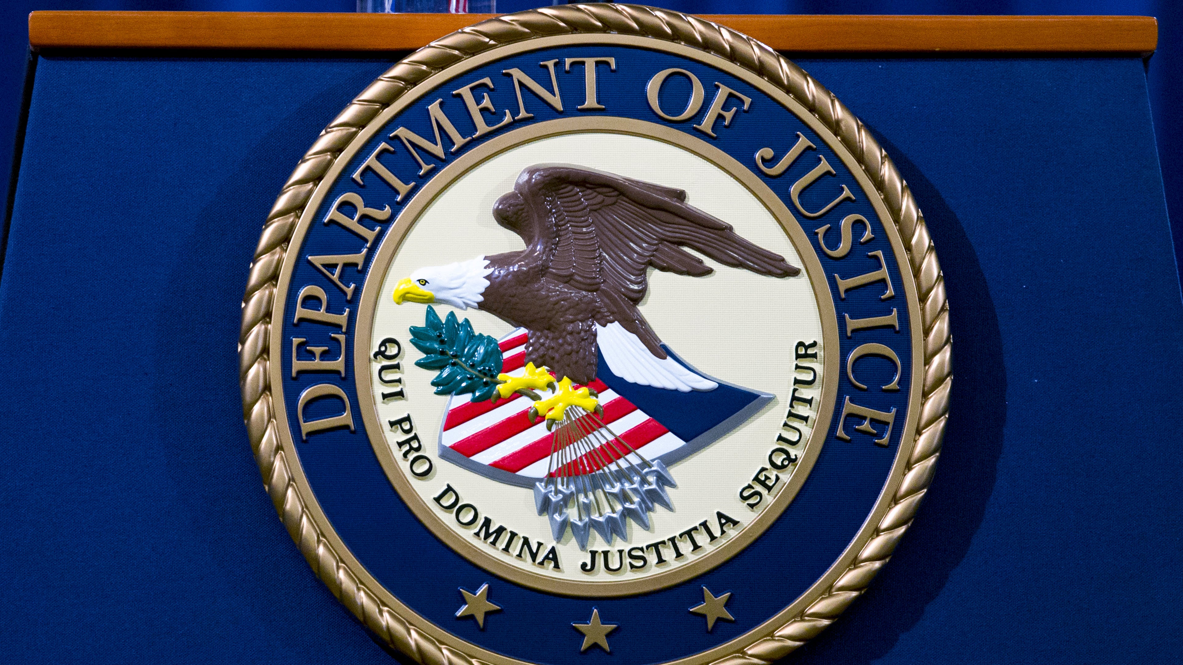FILE - The Department of Justice seal is seen in Washington, Nov. 28, 2018. (AP Photo/Jose Luis Magana, File)