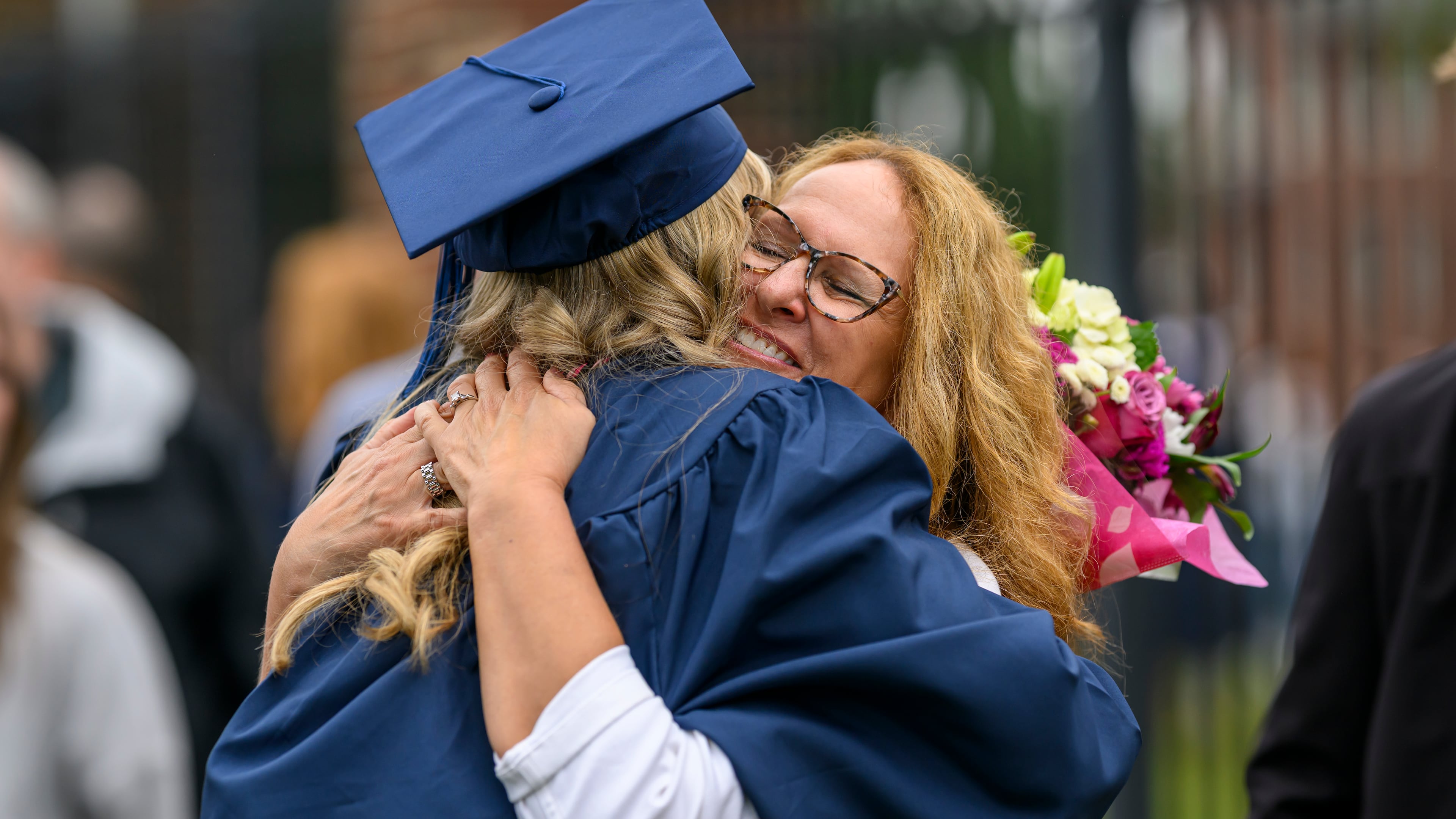 Berry College graduate Kara Schmit gets a hug from her mom, Sue Schmit, Saturday, May 9, 2026. (Courtesy of Brant Sanderlin/Berry College)