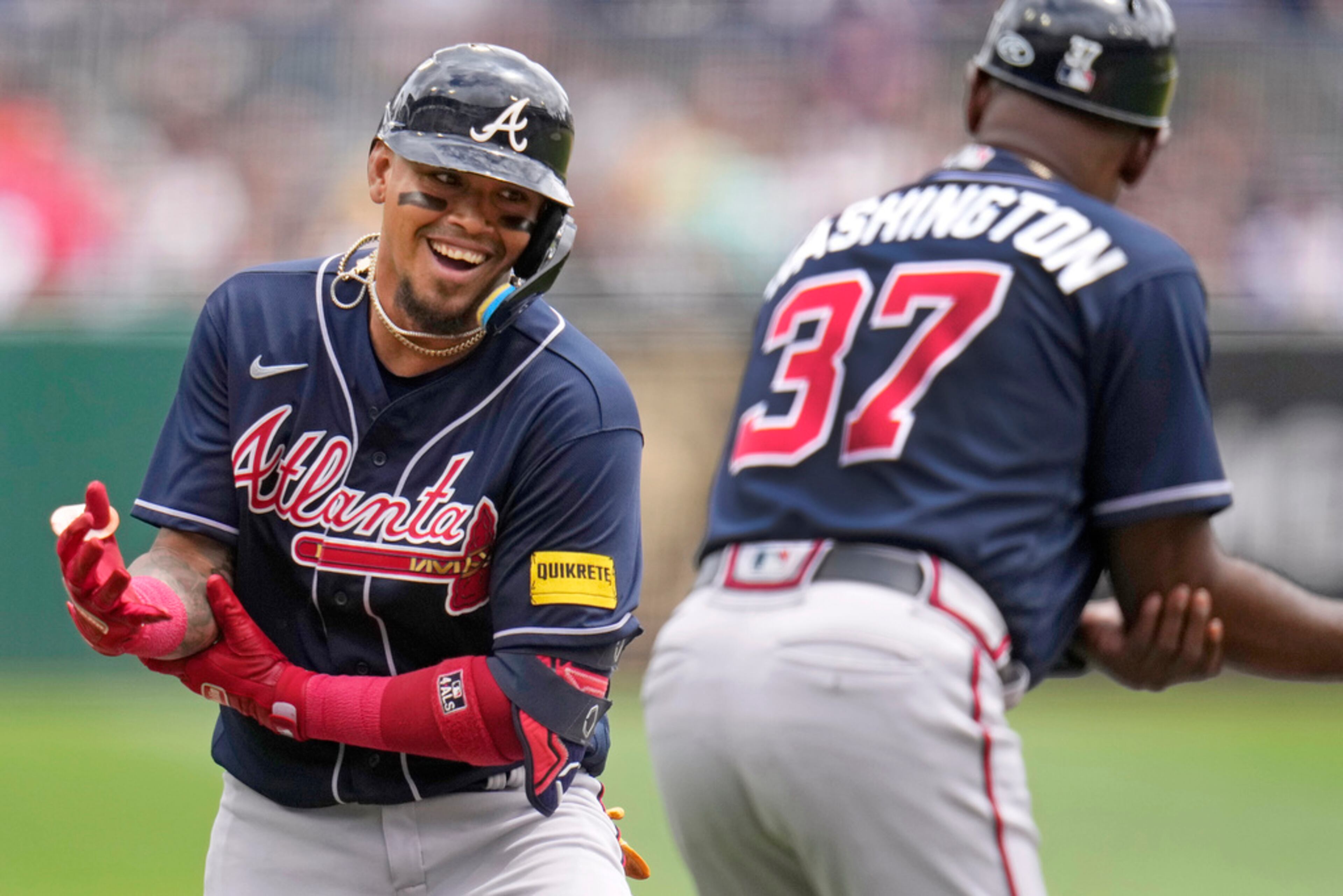 Atlanta Braves' Orlando Arcia, left, celebrates with third base coach Ron Washington (37) as he rounds third after hitting a solo home run off Pittsburgh Pirates starting pitcher Bailey Falter during the second inning of a baseball game in Pittsburgh, Thursday, Aug. 10, 2023. (AP Photo/Gene J. Puskar)
