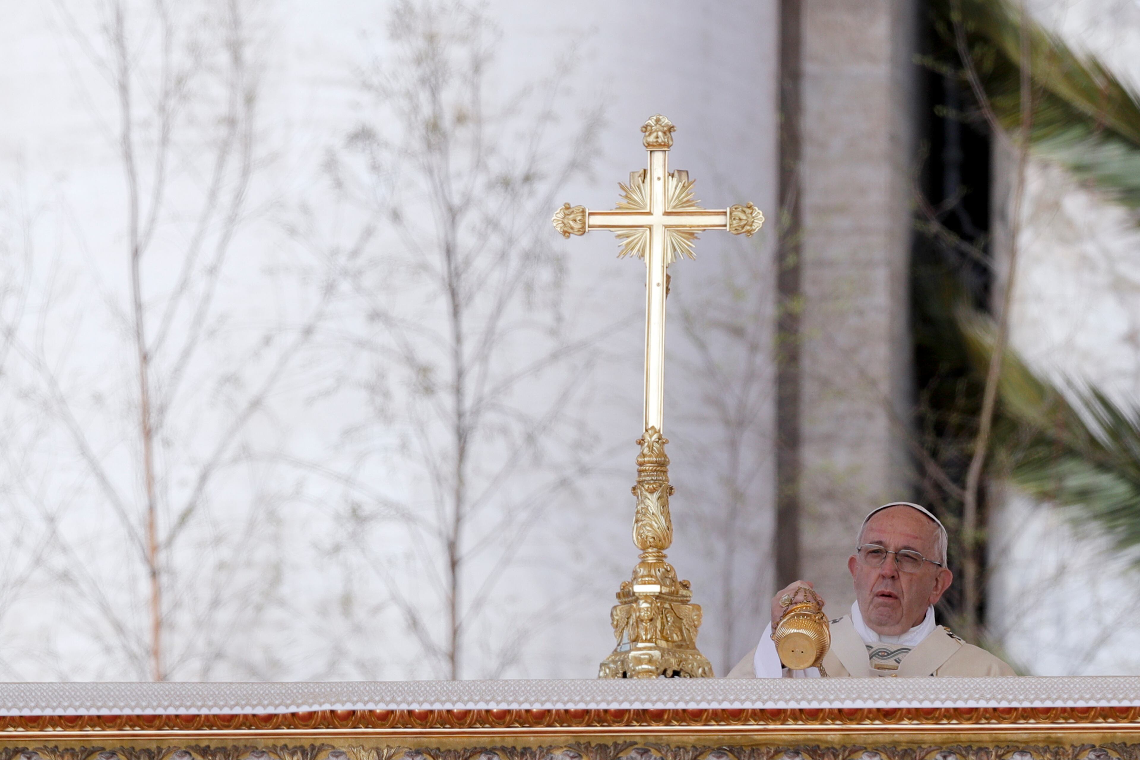 Pope Francis incenses the altar as he celebrates an Easter mass, in Peter's Square at the Vatican, Sunday, April 1, 2018. (AP Photo/Andrew Medichini)
