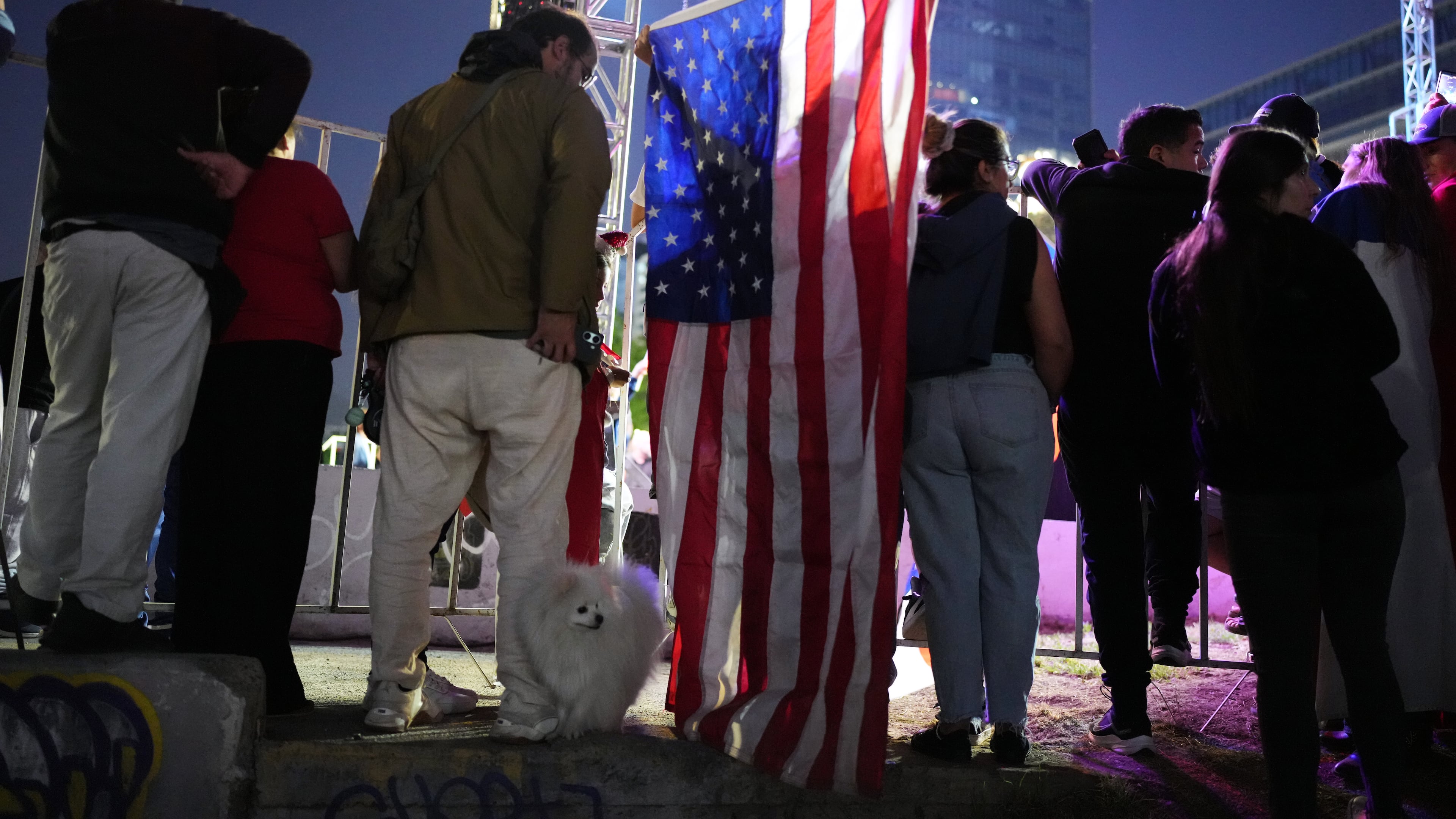 Supporters listen to Presidential candidate Jose Antonio Kast, of the opposition Republican Party, delivering his victory speech after winning the presidential runoff election in Santiago, Chile, Sunday, Dec. 14, 2025. (AP Photo/Natacha Pisarenko)