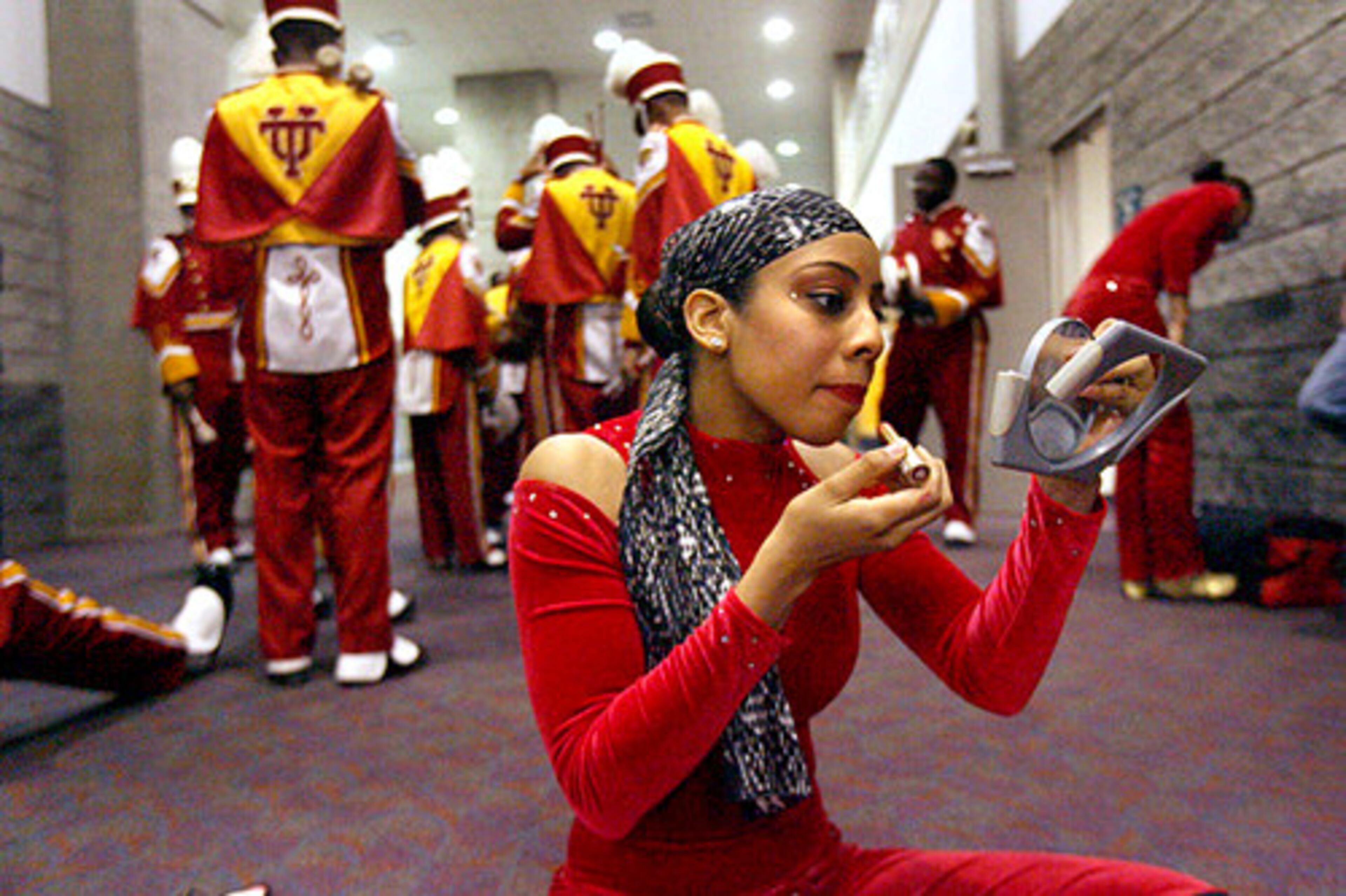 Dorothy Kingwood, from Tuskegee University, puts on makeup before the start of the competition.