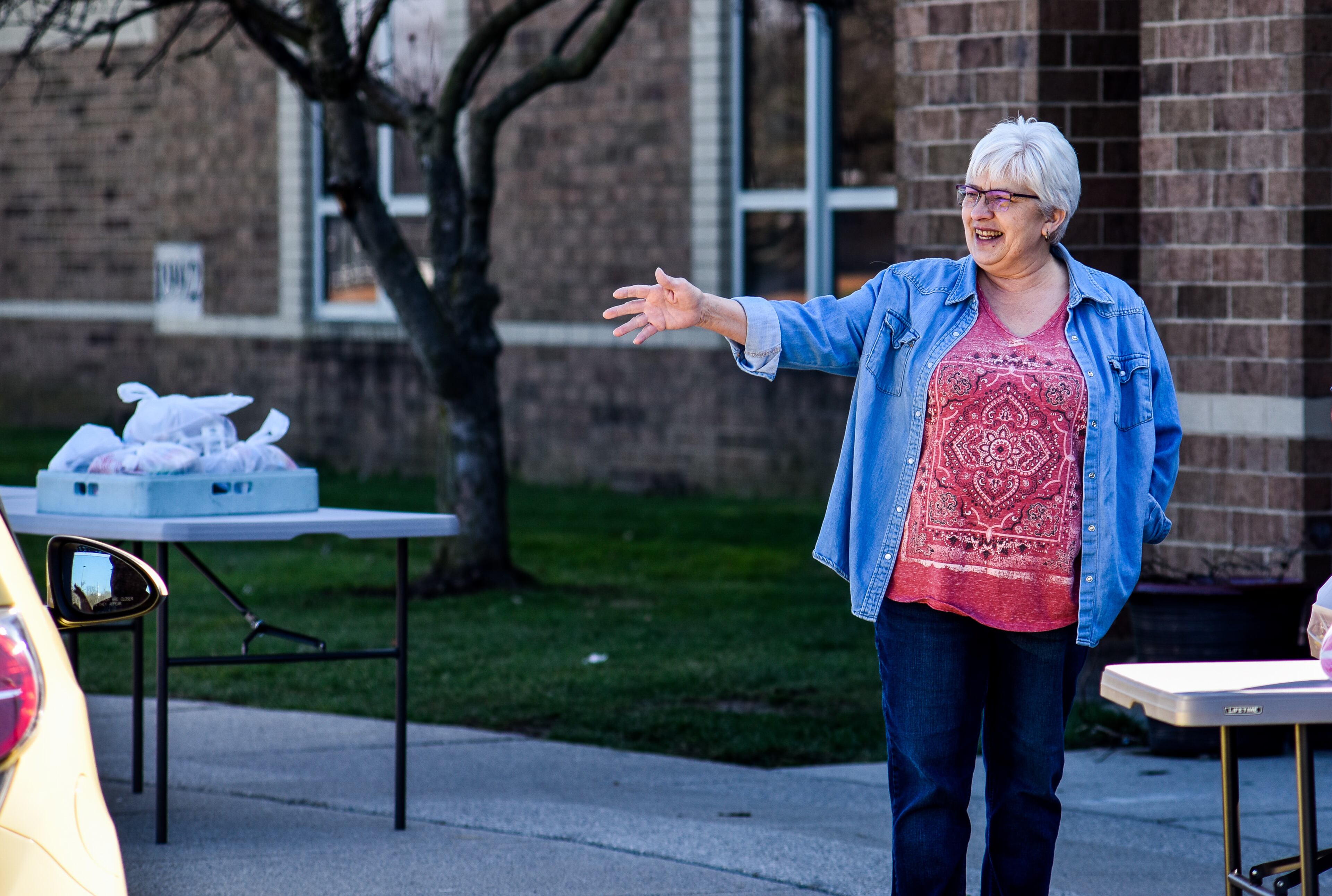 Edgewood schools lunch staff hand out lunches in front of Edgewood Elementary School Wednesday morning, March 25, 2020 in St. Clair Township. The district, like many other districts in the area, is offering lunches to children at three different elembentary school locations on Monday, Wednesday and Friday to get lunches to kids while school is shut down during the coronavirus pandemic. NICK GRAHAM / STAFF