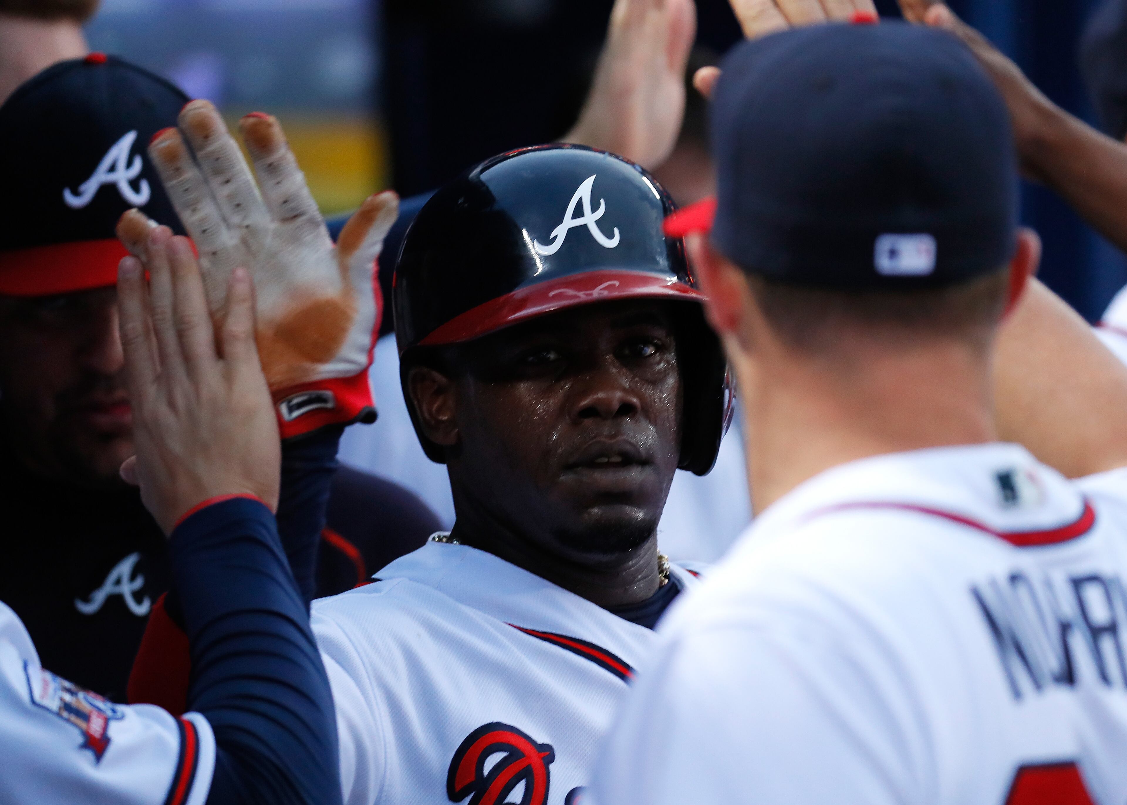 ATLANTA, GA - JUNE 14: Adonis Garcia #13 of the Atlanta Braves scores on a sacrifice bunt by Julio Teheran #49 in the fourth inning against the Cincinnati Reds at Turner Field on June 14, 2016 in Atlanta, Georgia. (Photo by Kevin C. Cox/Getty Images)