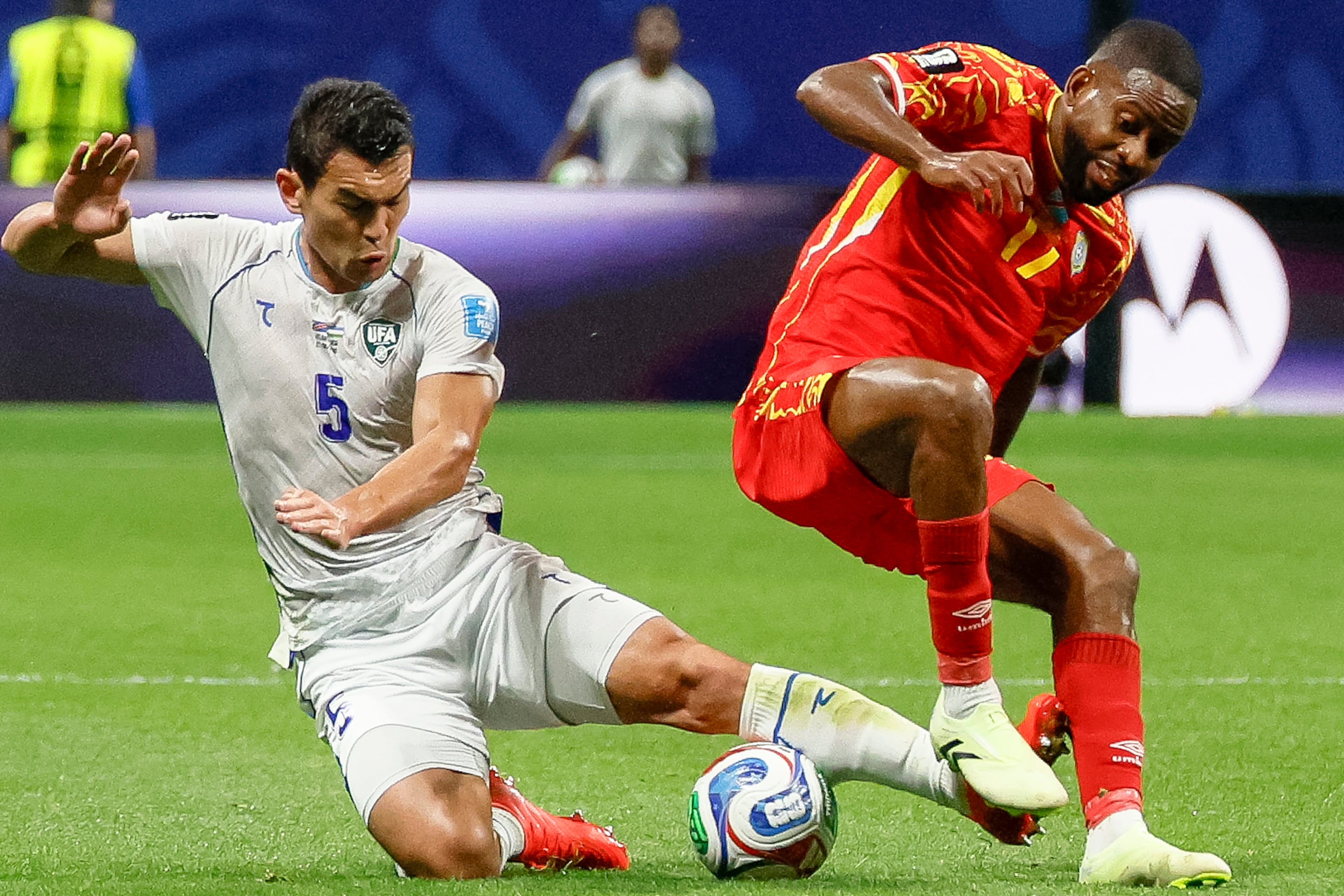 Uzbekistan defender Rustam Ashurmatov (left) and Congo forward Cédric Bakambu (right) battle for control during the first half of a FIFA World Cup match at Atlanta Stadium (Mercedes-Benz Stadium) on Saturday, June 27, 2026, in Atlanta. (Miguel Martinez/AJC)