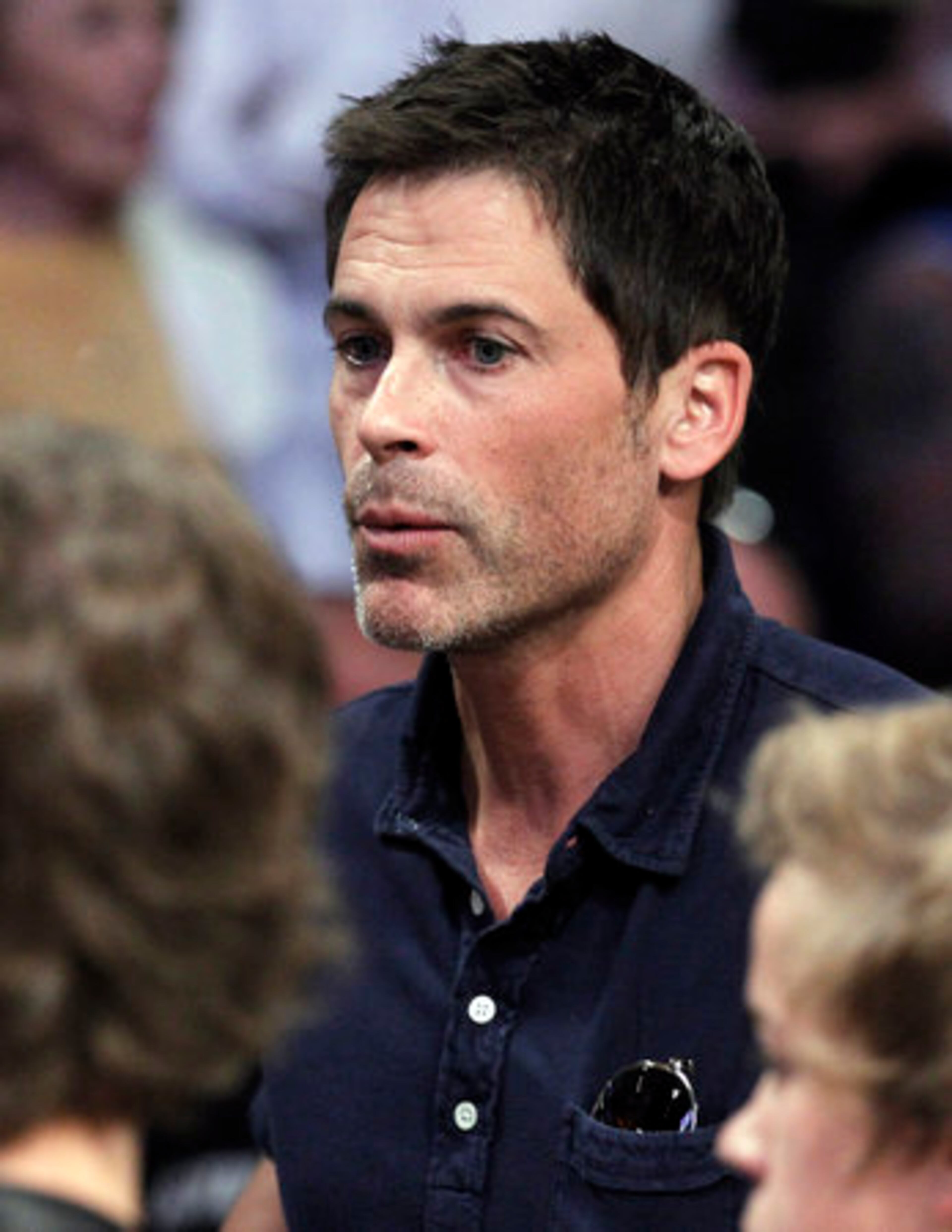 Actor Rob Lowe watches the Los Angeles Lakers and the Boston Celtics during the second half of Game 2 of the NBA basketball finals Sunday, June 6, 2010, in Los Angeles.