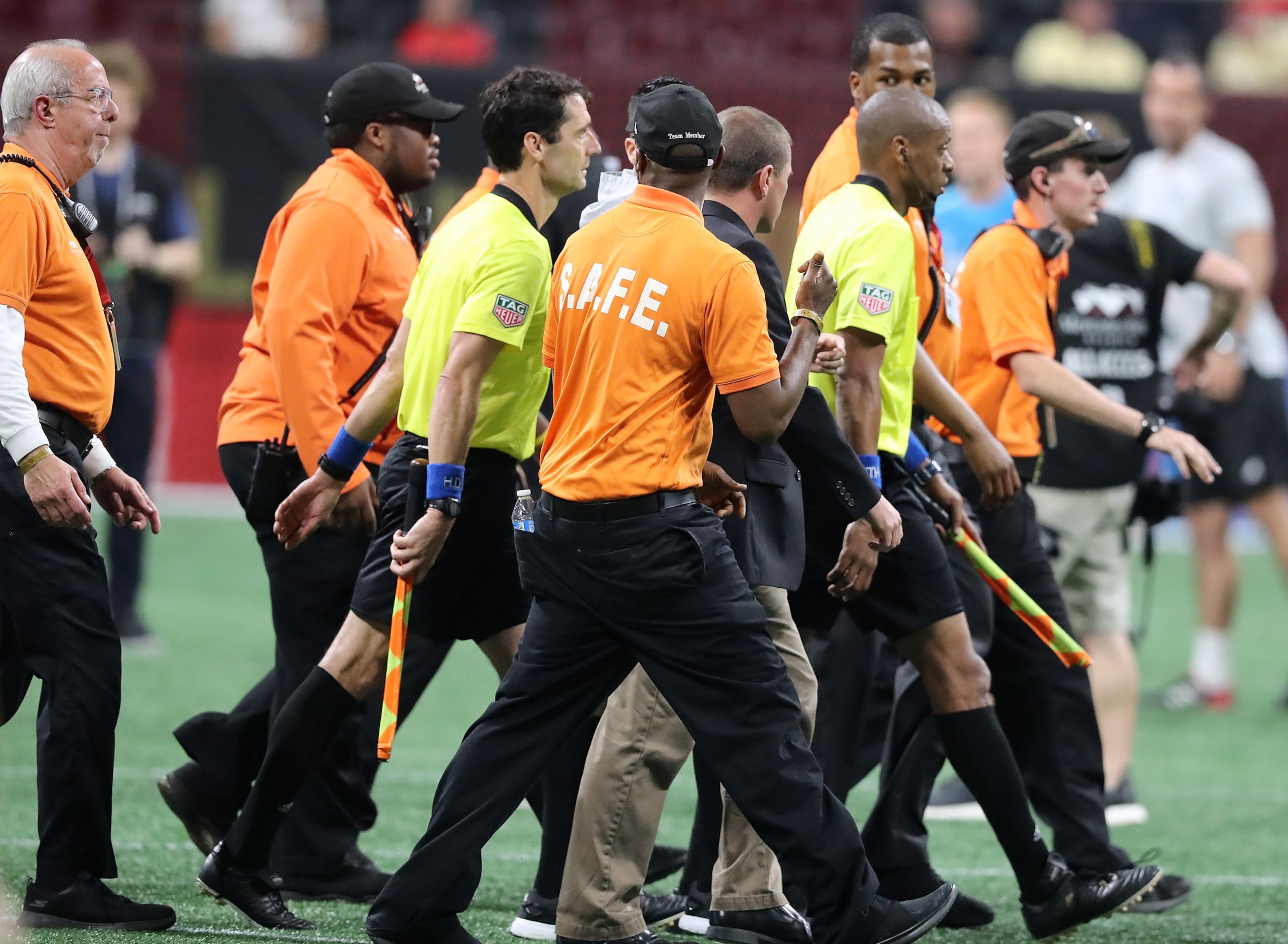 May 9, 2018 Atlanta: Security guards escort the game officials off the field after a heated match between Atlanta United and Sporting Kansas City in a MLS soccer match on Wednesday, May 9, 2018, in Atlanta. Curtis Compton/ccompton@ajc.com