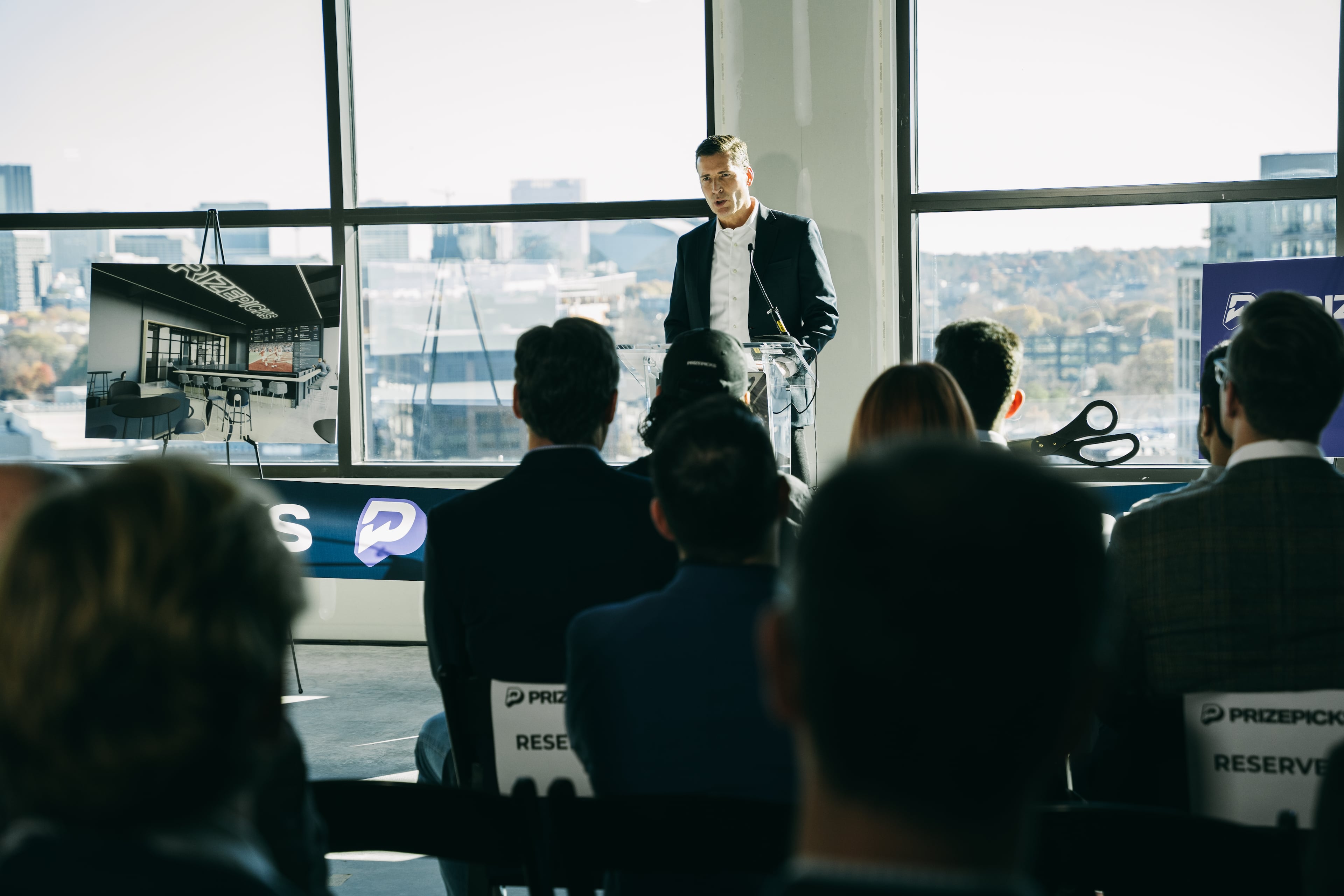 PrizePicks CEO Mike Ybarra speaks at his company's office ribbon-cutting ceremony in Atlanta on Thursday, Dec. 12, 2024 (Olivia Bowdoin for the AJC).