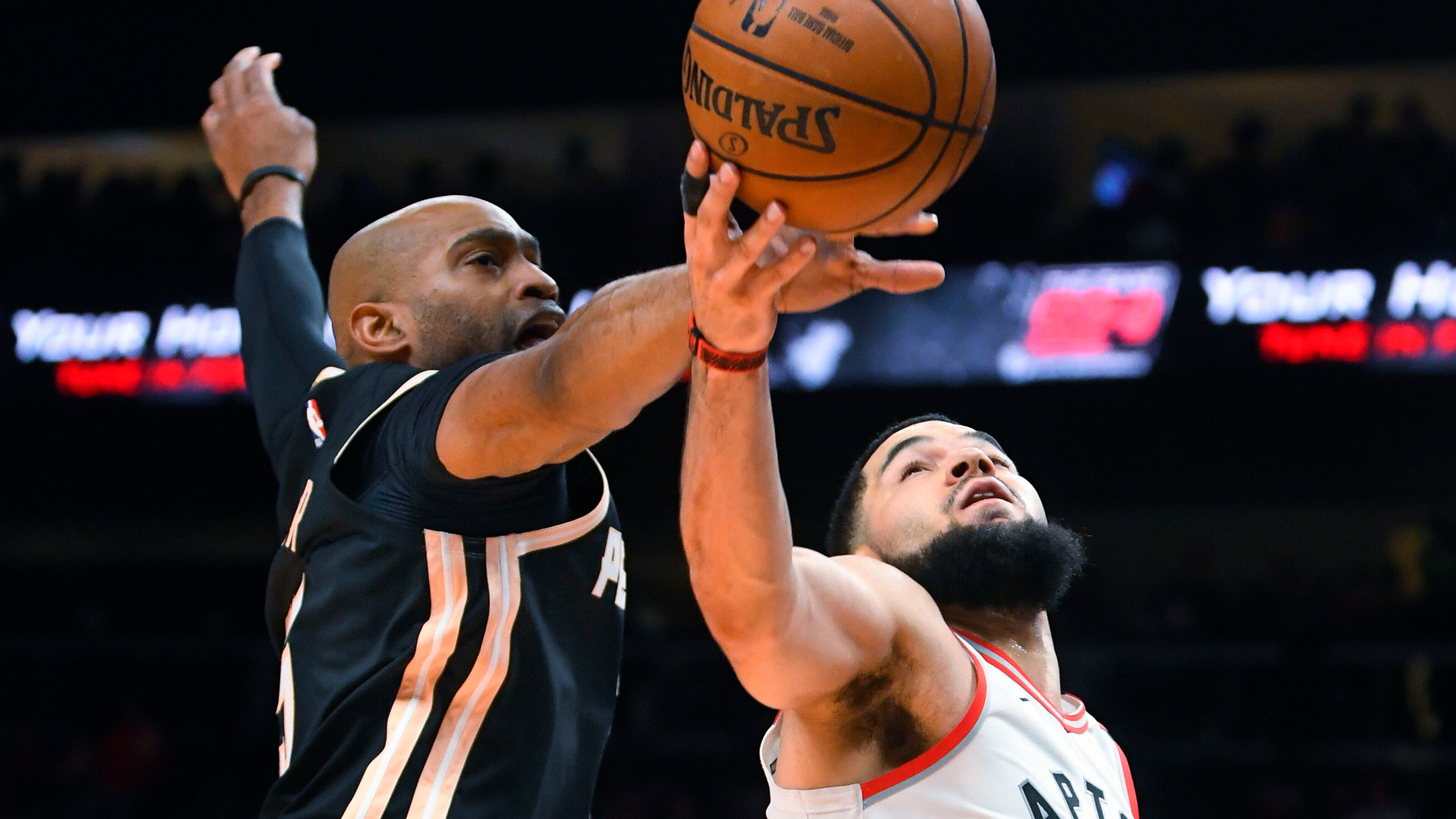 Hawks guard Vince Carter blocks a shot by Raptors guard Fred VanVleet during the second half Monday, Jan. 20, 2020, at State Farm Arena in Atlanta. Toronto won 122-117.