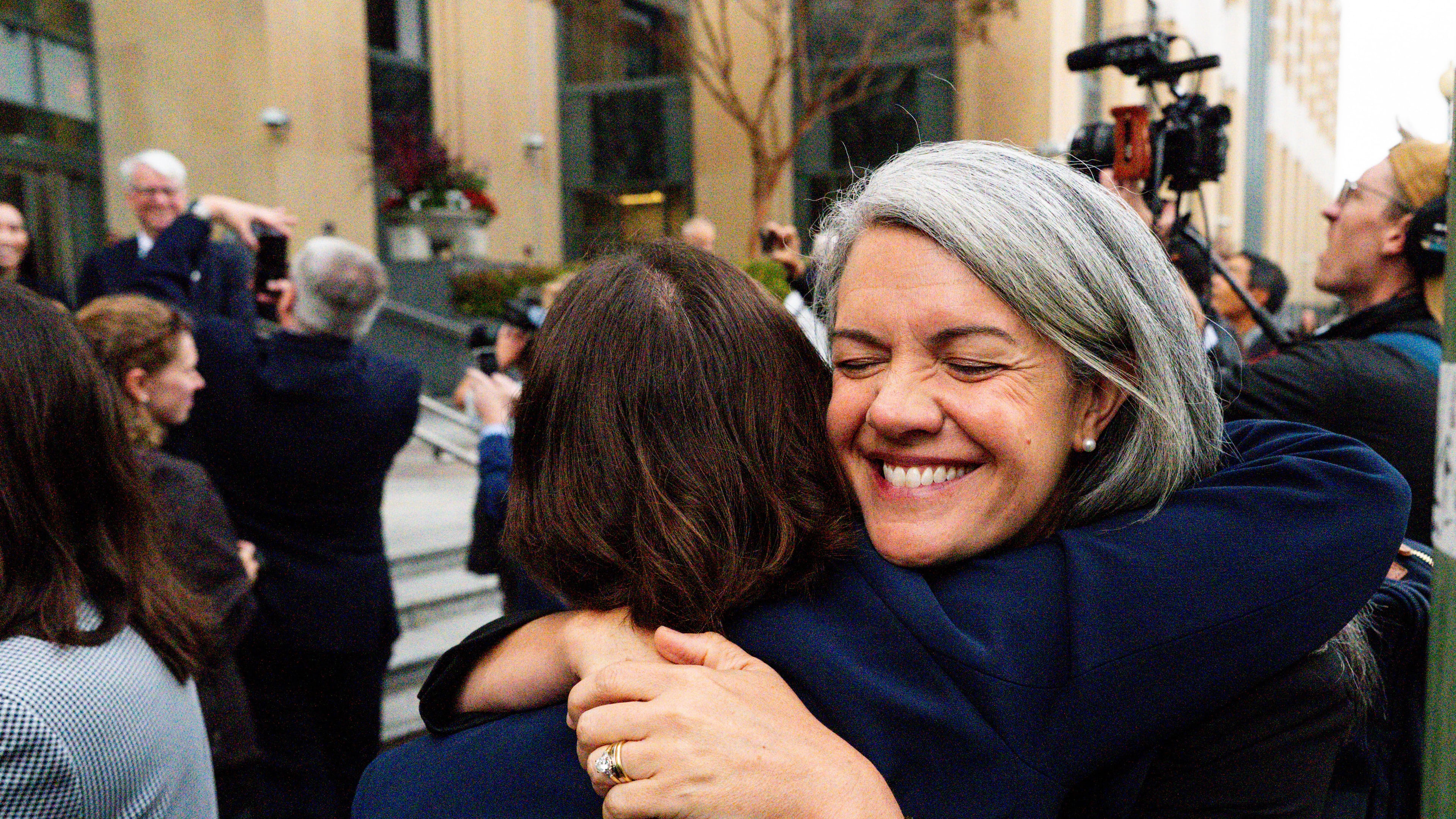 Colorado Solicitor General Shannon Stevenson, right, hugs a colleague outside of court after tech giant Meta agreed to pay $17 billion as part of a settlement to end a landmark trial over teen social media addiction in Oakland, Wednesday, Aug. 26, 2026. (AP Photo/Noah Berger)