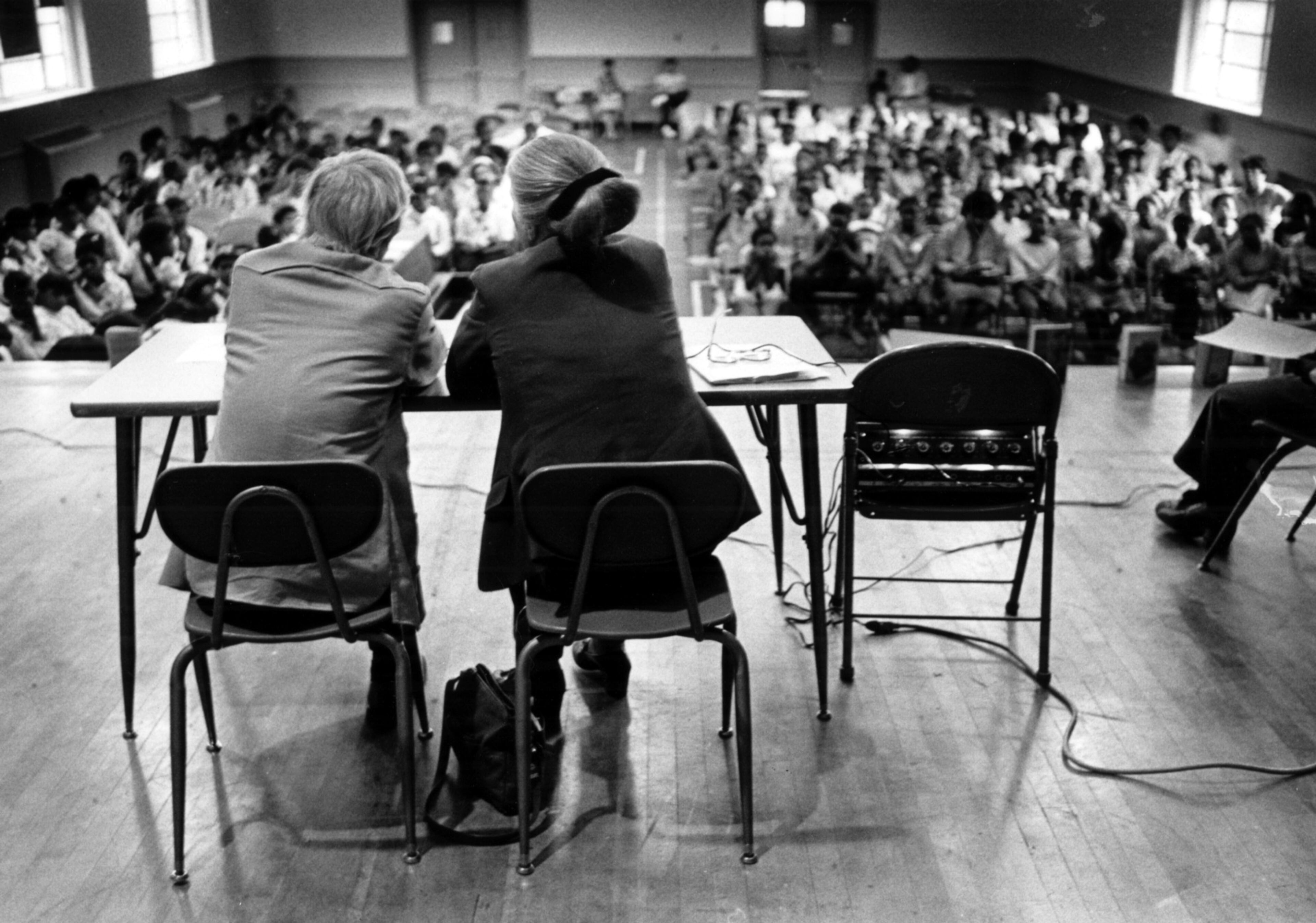 May 9, 1985 - Children's author Lloyd Alexander is shown seated with Kemie Nix, children's literature teacher at Ed E. Cook Elementary School Thursday morning. Alexander was there to answer kid's questions about being a famous author.