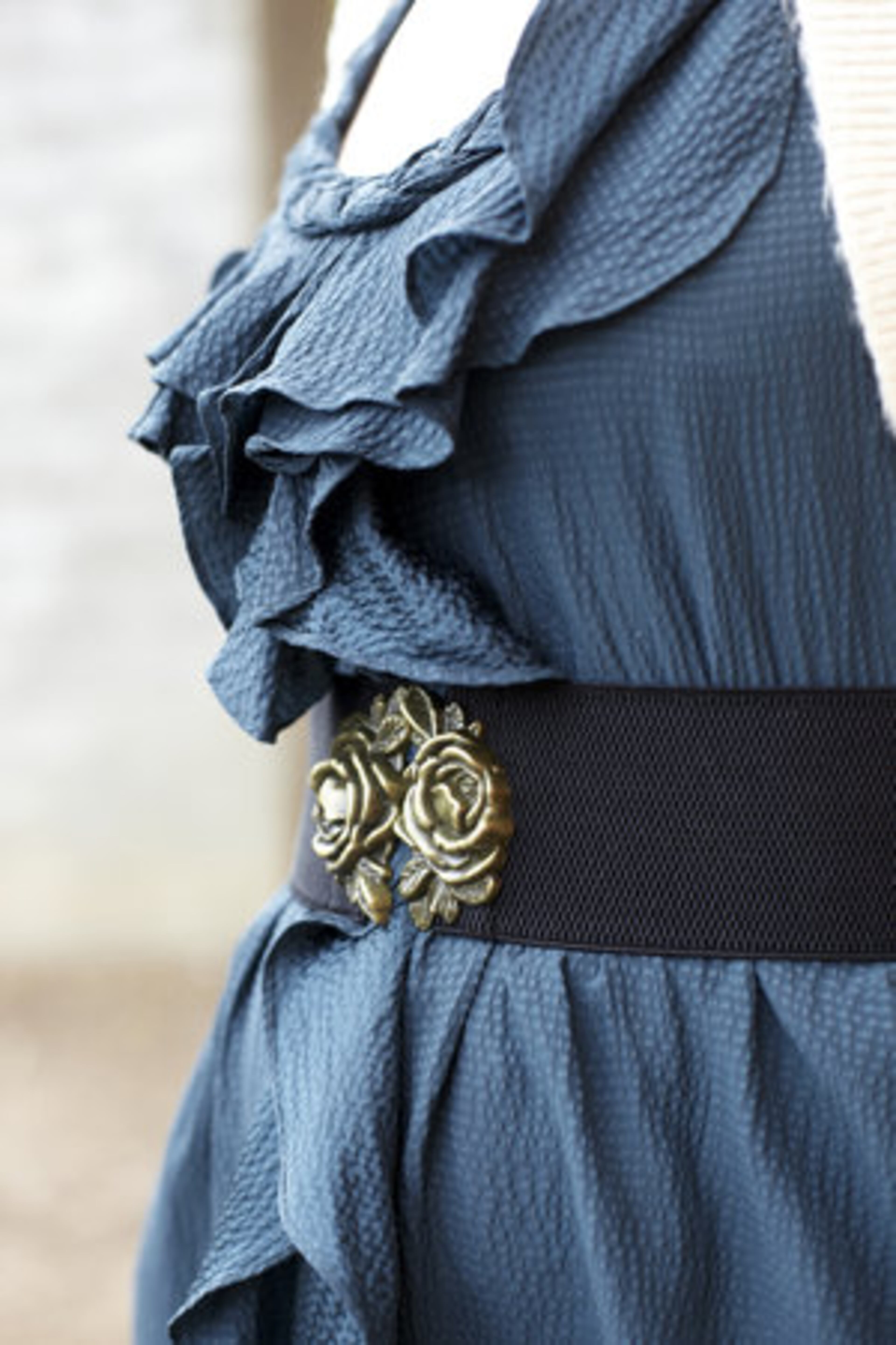 Bransford accesorizes her ruffled Rebecca Taylor dress with a flower cinch belt from Anthropologie.