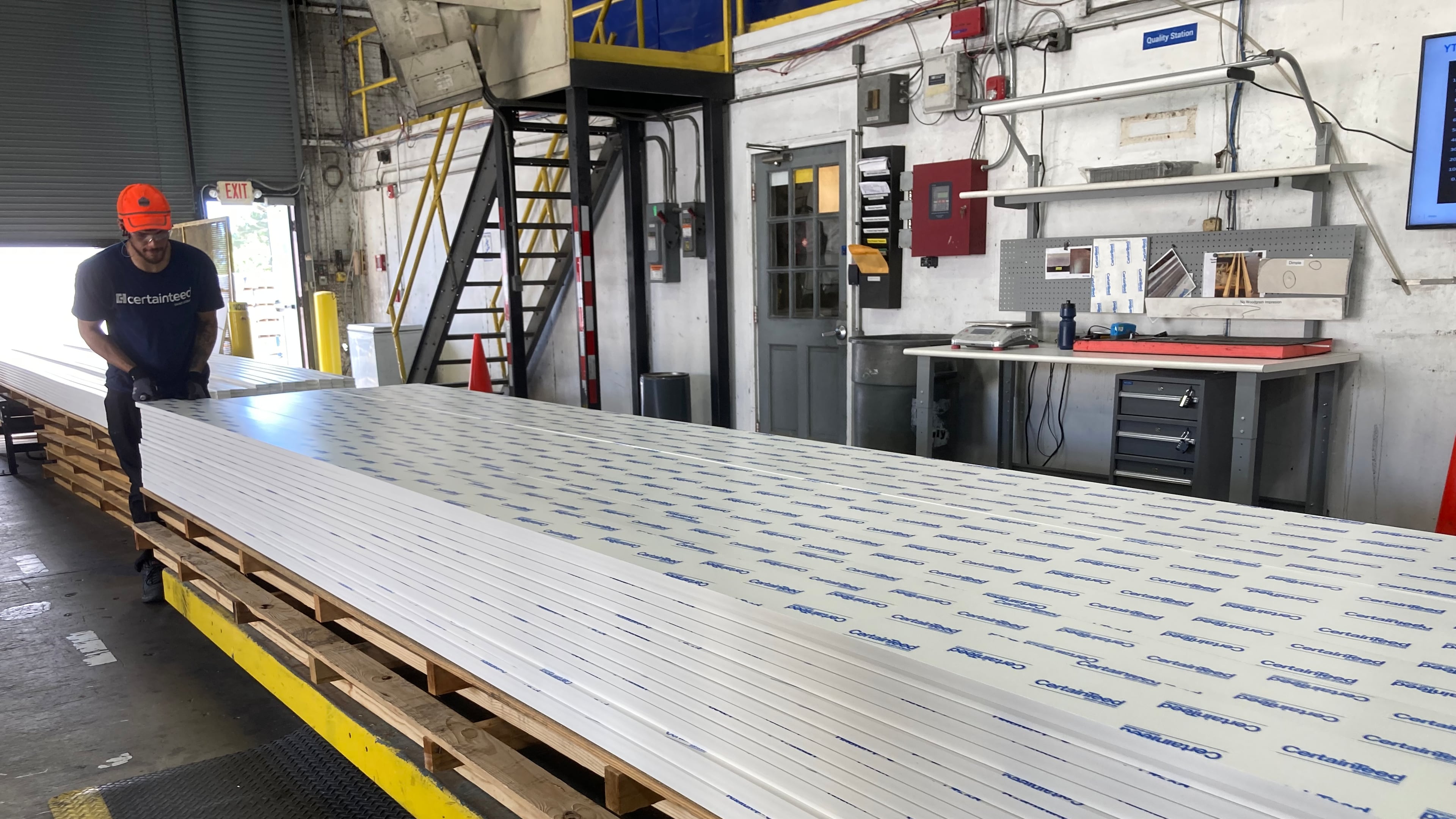 Foreign-owned factories are an essential part of manufacturing in Georgia. Here, an assembly line at the Saint-Gobain plant in Social Circle produces PVC trimboards which are used in homes around windows and doors. (Michael E. Kanell/AJC)