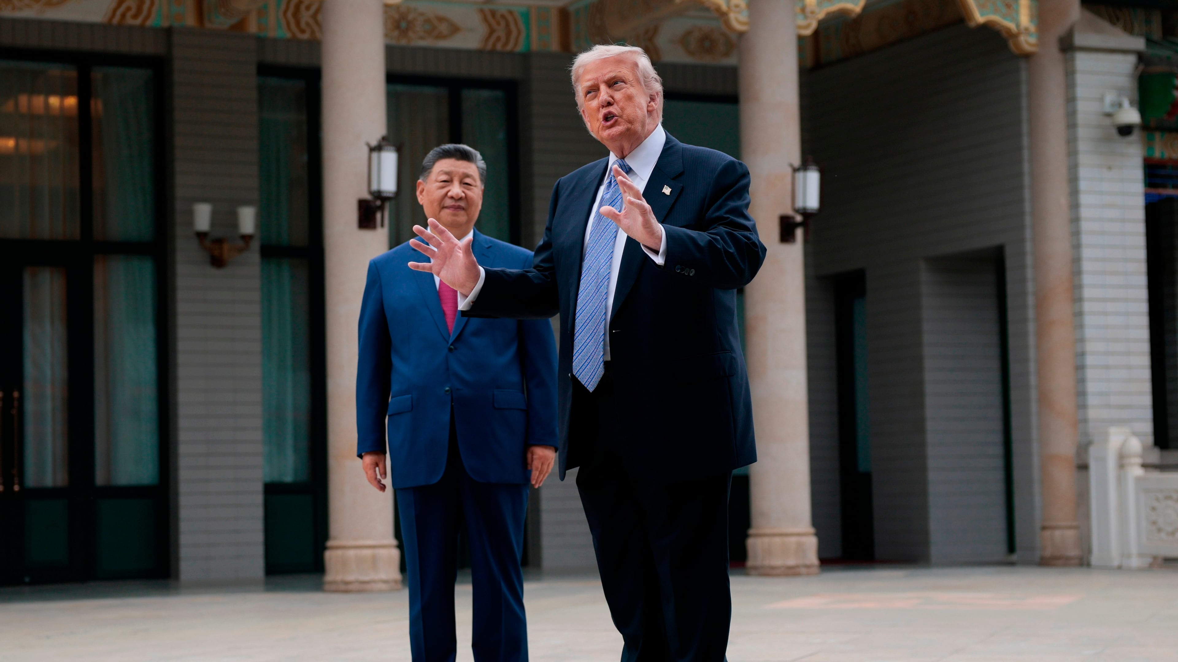 U.S. President Donald Trump, right, gestures as he speaks next to Chinese President Xi Jinping during a visit to the Zhongnanhai Garden in Beijing, China, Friday, May 15, 2026. (Evan Vucci/Pool Photo via AP)
