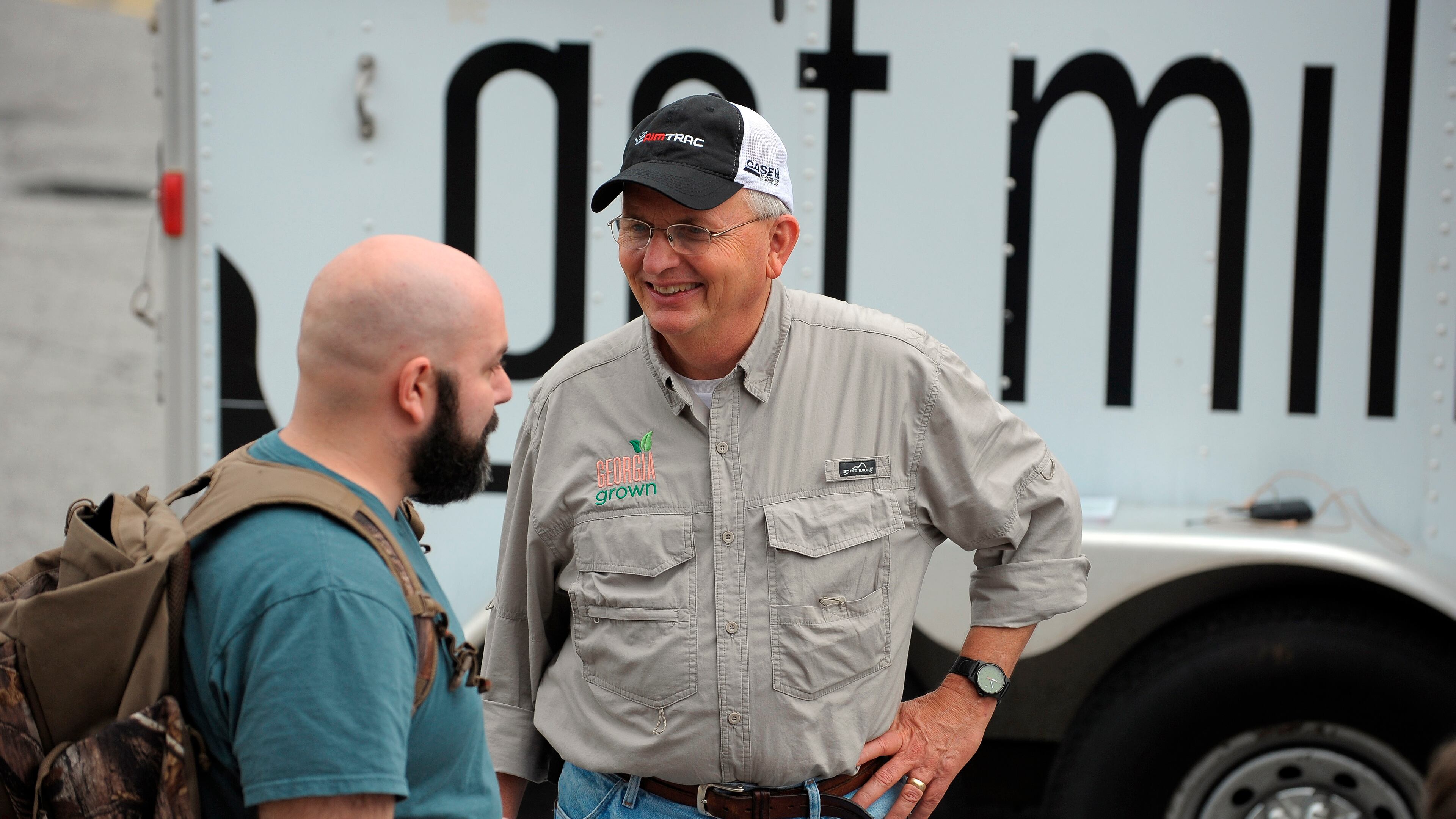 Georgia Agriculture Commissioner Gary Black, right, talks with Pete Chagnon of New Life FM radio at the Georgia Grown Farmers Showcase which features agricultural products from all corners of Georgia coming together under one shed for one day on Saturday, July 27, 2013, at the Atlanta State Farmers Market. David Tulis / AJC Special