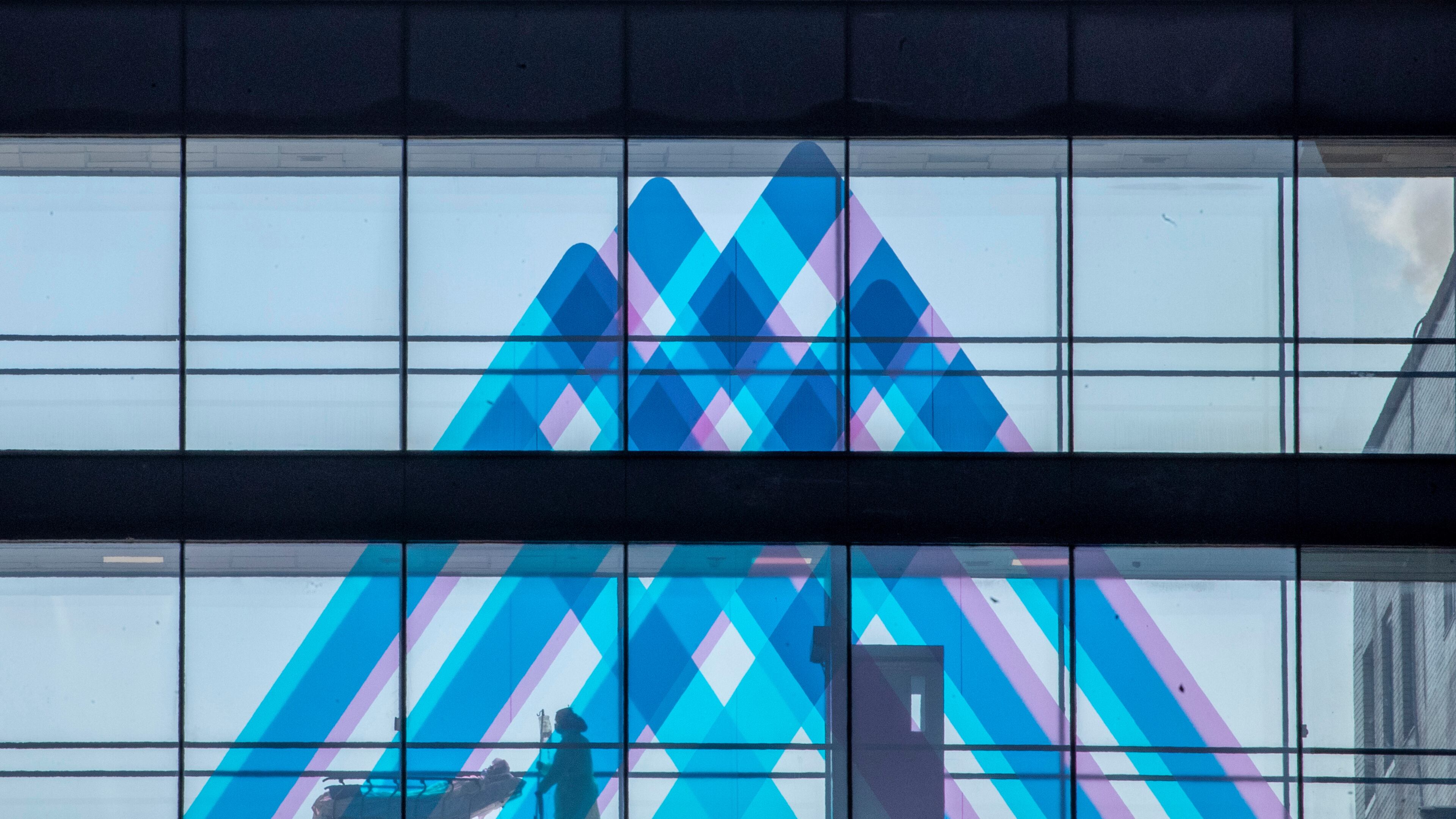 FILE - A medical worker transports a patient at Mount Sinai Hospital, April 1, 2020, in New York. (AP Photo/Mary Altaffer, File)