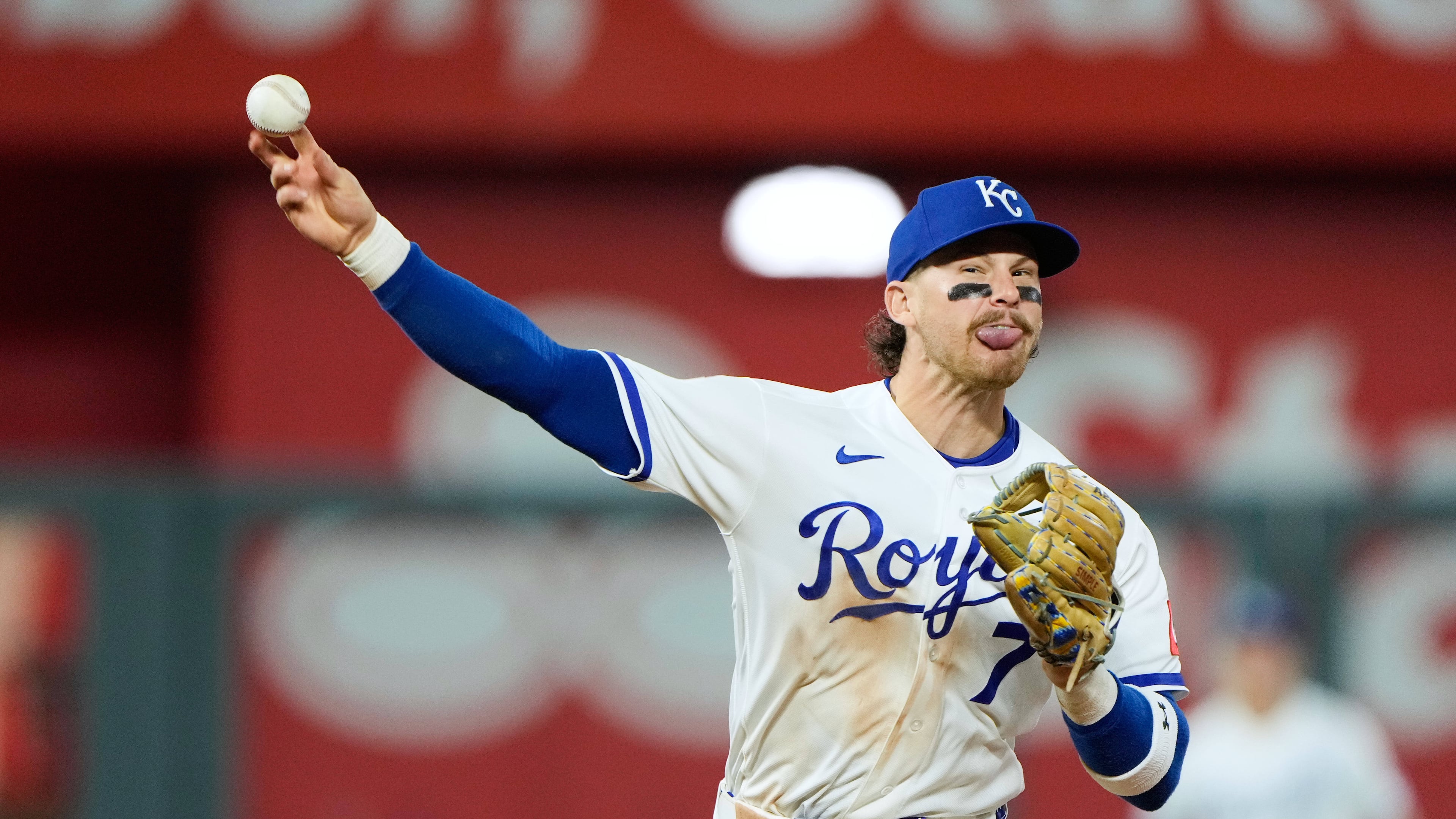 Kansas City Royals shortstop Bobby Witt Jr. throws to first for the double play hit into by Baltimore Orioles' Colton Cowser during the ninth inning of a baseball game Tuesday, April 21, 2026, in Kansas City, Mo. (AP Photo/Charlie Riedel)