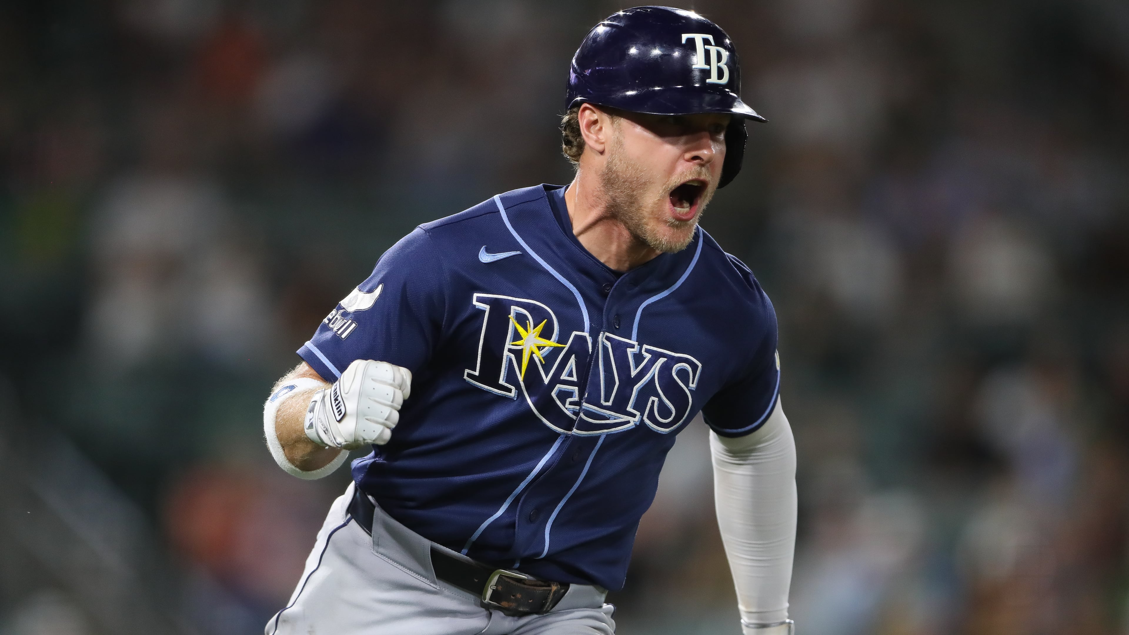 Tampa Bay Rays' Taylor Walls reacts as he heads towards first base on a two RBI single during the eighth inning of a baseball game against the Athletics Monday, Aug. 10, 2026, in West Sacramento, Calif. (AP Photo/Scott Marshall)