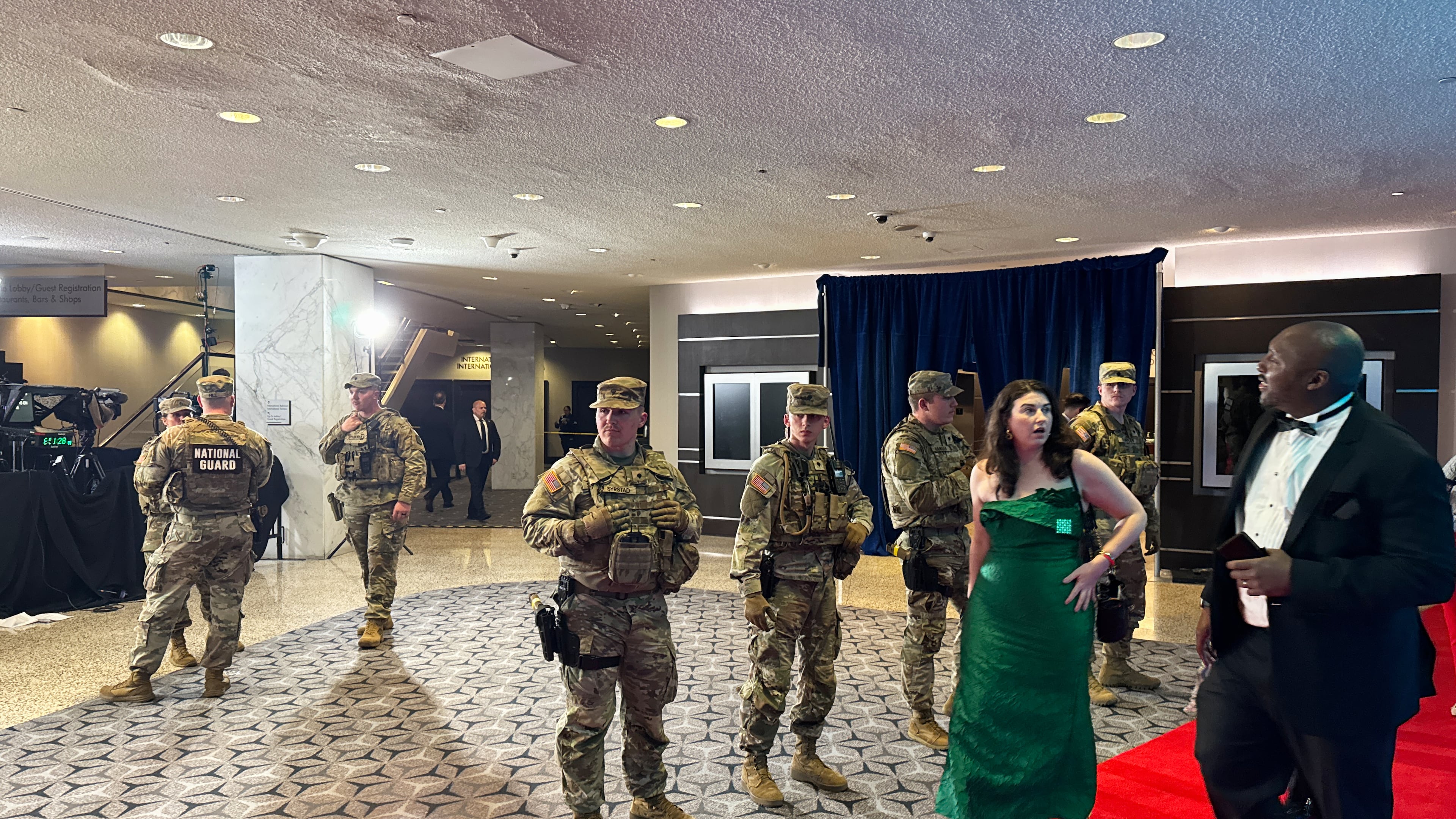 The National Guard respond to an incident at the White House Correspondents Dinner, Saturday, April 25, 2026, in Washington. (AP Photo/Mark Schiefelbein)