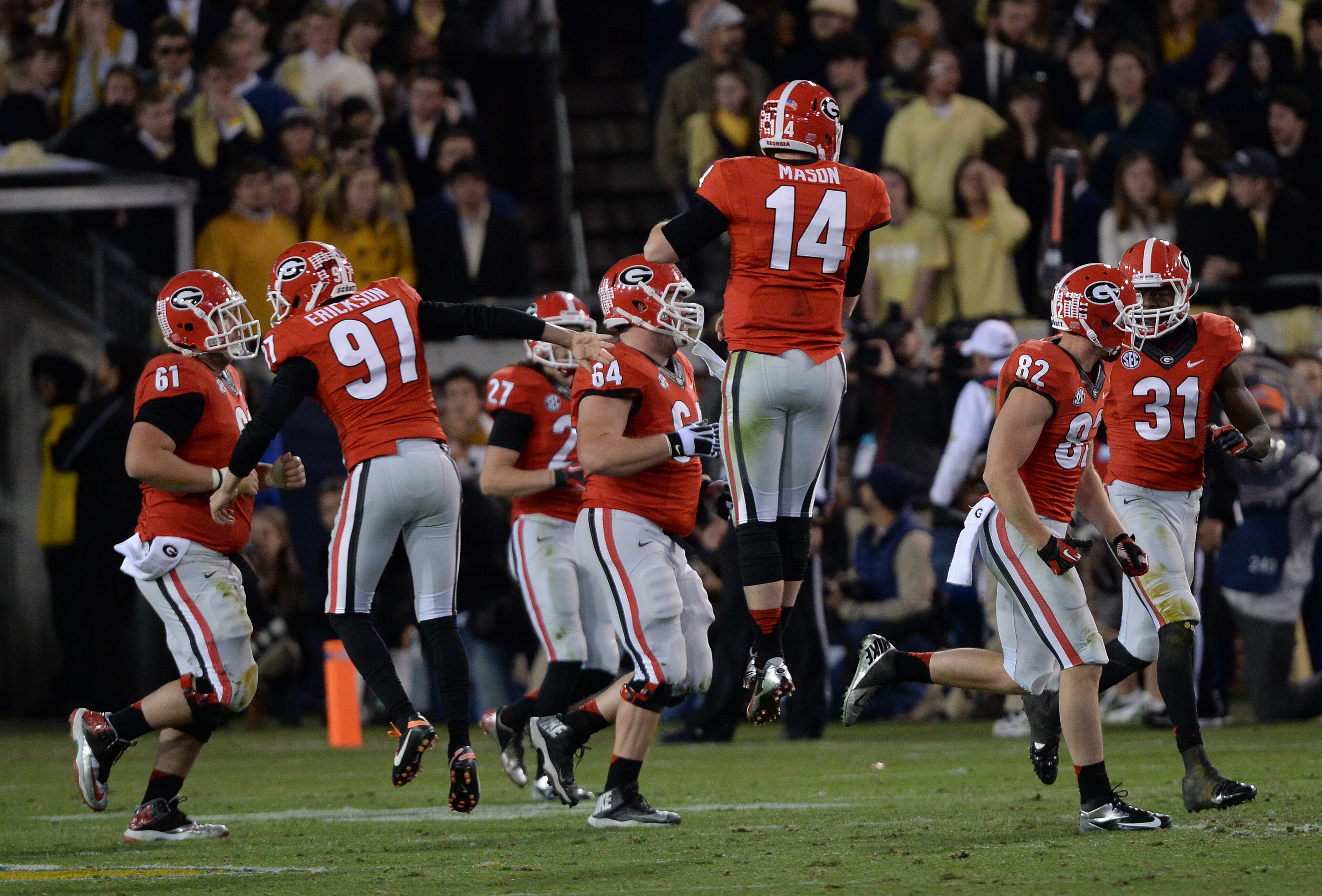Georgia's Hutson Mason jumps in the air after throwing a touchdown during the Georgia Tech vs. Georgia football game on Saturday, November 30, 2013, at Bobby Dodd Stadium in Atlanta. Georgia won the game 41 to 34.