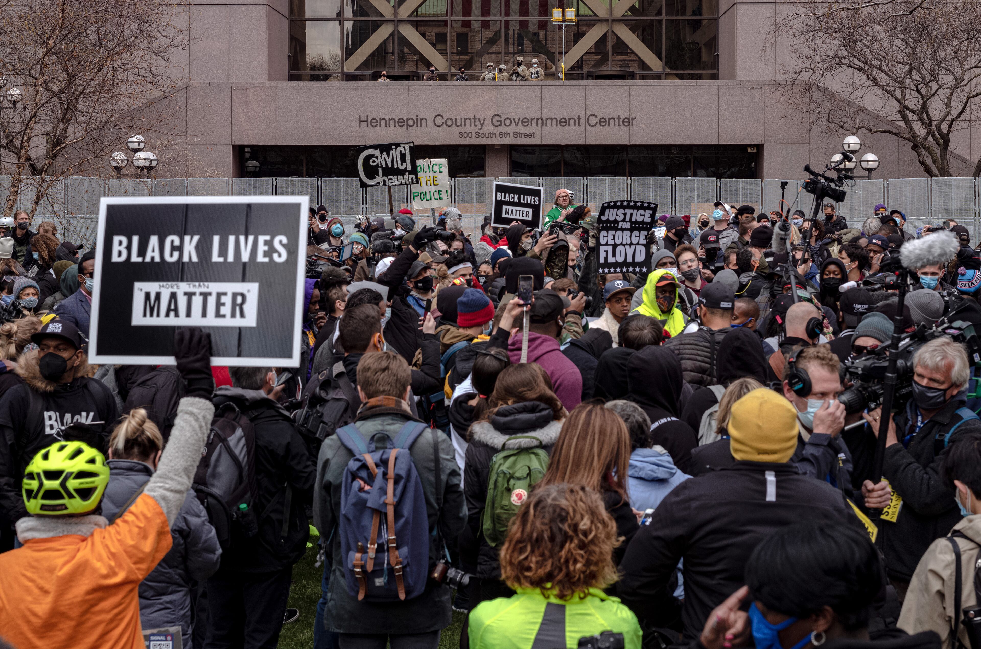 People gather outside the Hennepin Country Government Center in Minneapolis on Tuesday, April 20, 2021, as the jury prepares to deliver a verdict in the Derek Chauvin trial. Chauvin, a former Minneapolis police officer is charged in the death of George Floyd while in police custody last year. (Amr Alfiky/The New York Times)