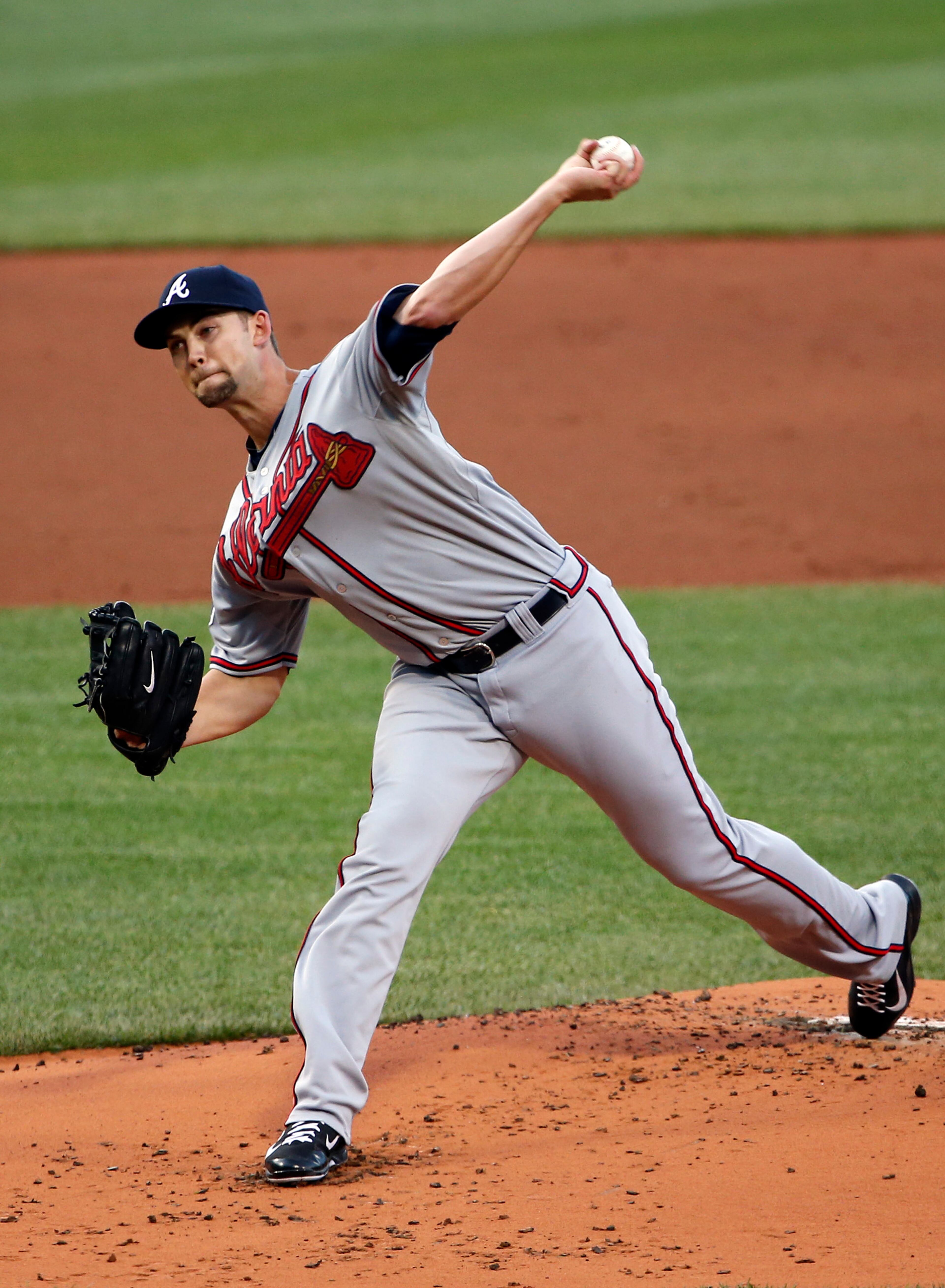 Atlanta Braves starting pitcher Mike Minor delivers against the Boston Red Sox during the first inning of a baseball game at Fenway Park in Boston on Thursday, May 29, 2014. (AP Photo/Winslow Townson)