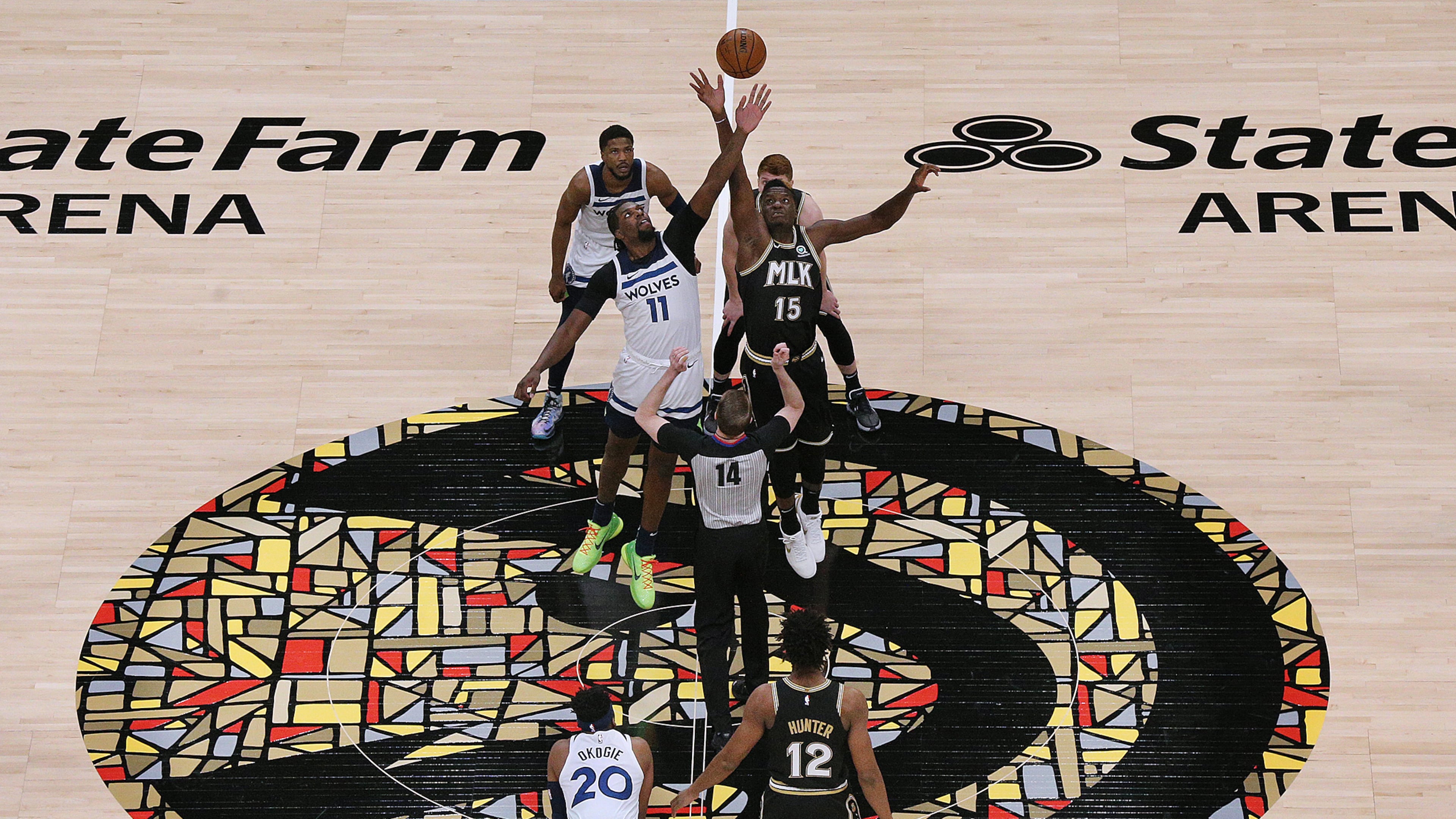 The Hawks and Timberwolves tip off their Martin Luther King Jr. Day game on Jan. 18, 2021, at State Farm Arena in Atlanta. With Atlanta being King's hometown, the Hawks further honored the civil rights icon as the first NBA team to wear a jersey featuring the letters “MLK.” (Curtis Compton/AJC 2021)
