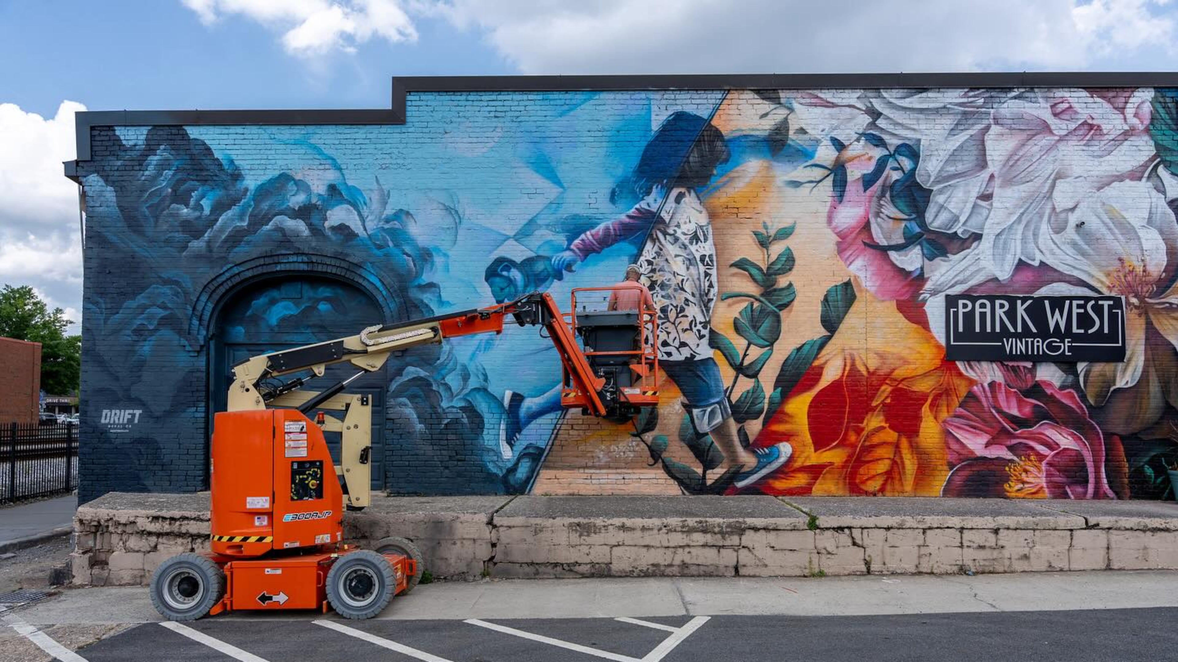 Final touches are being added to a new mural for the M2R TrailFest in Marietta. (Courtesy of the Marietta Arts Council)