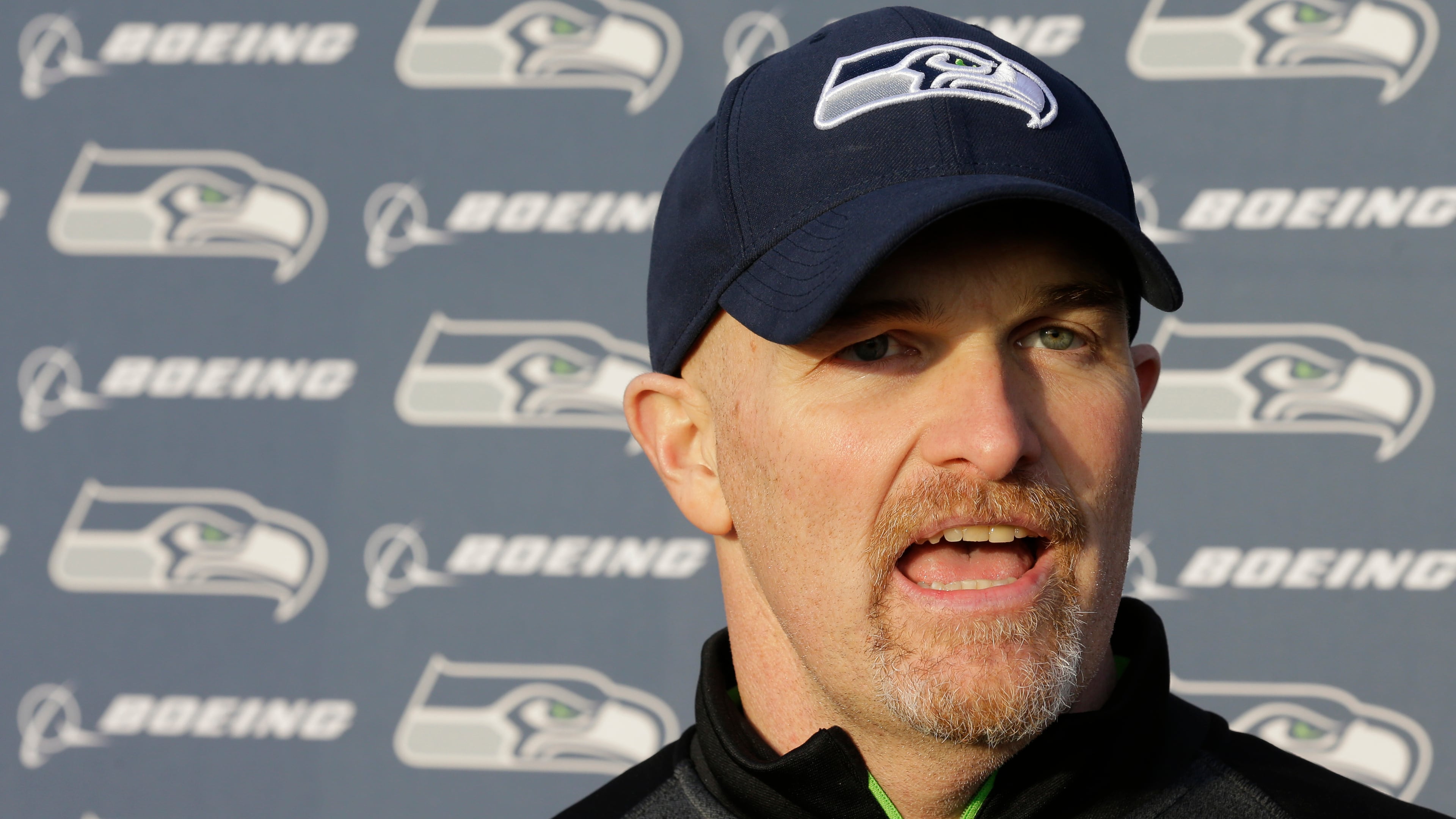 Seattle Seahawks defensive coordinator Dan Quinn talks to reporters after practice Wednesday, Jan. 7, 2015 in Renton, Wash. The Seahawks will play the Carolina Panthers on Saturday in an NFL football divisional playoff game. (AP Photo/Ted S. Warren) Seattle defensive coordinator Dan Quinn could be Falcons' next head coach. (AP photo)