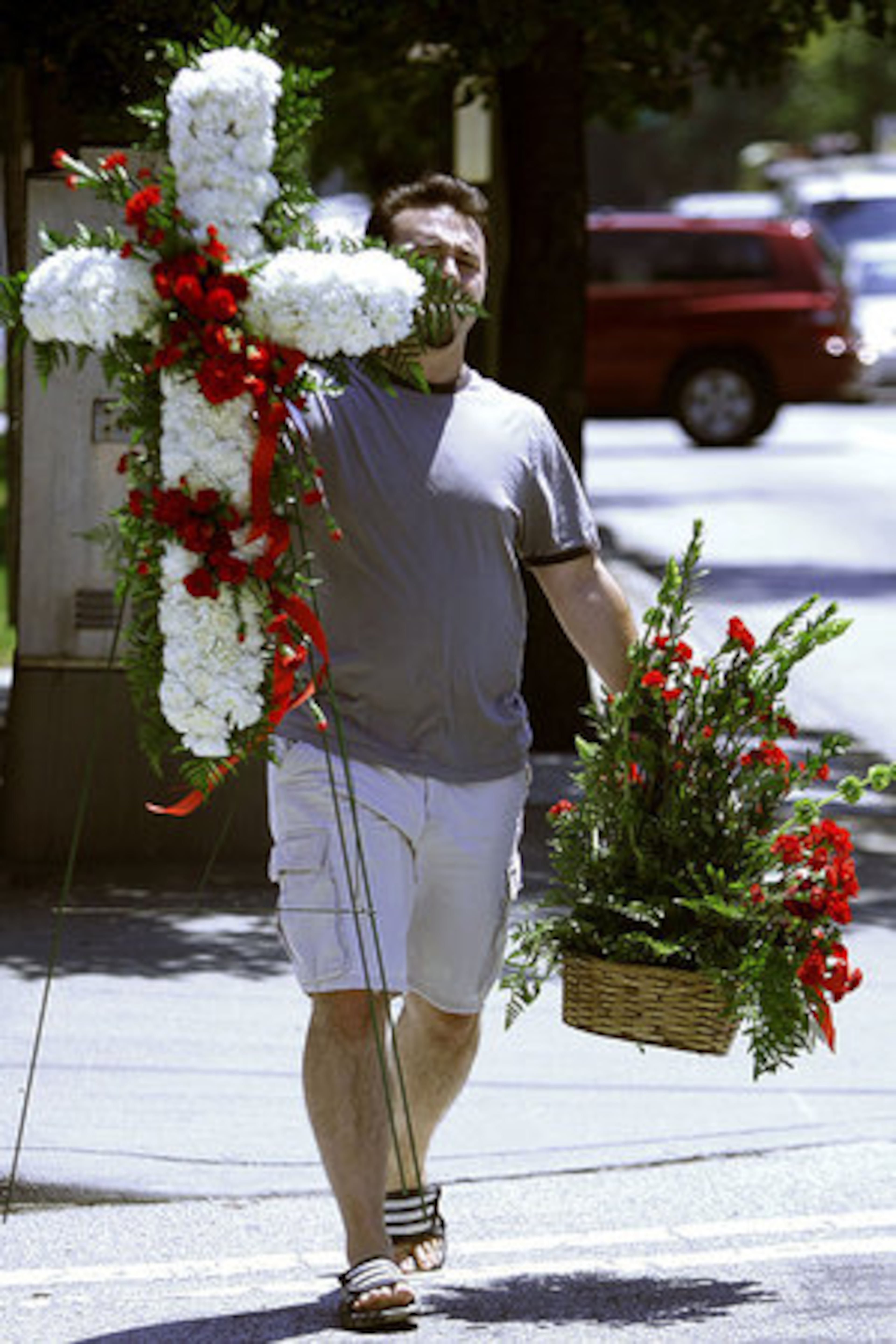 Jay Shandolow, with The Best Little Flower Shop in Roswell, delivers flowers from Chipper Jones.