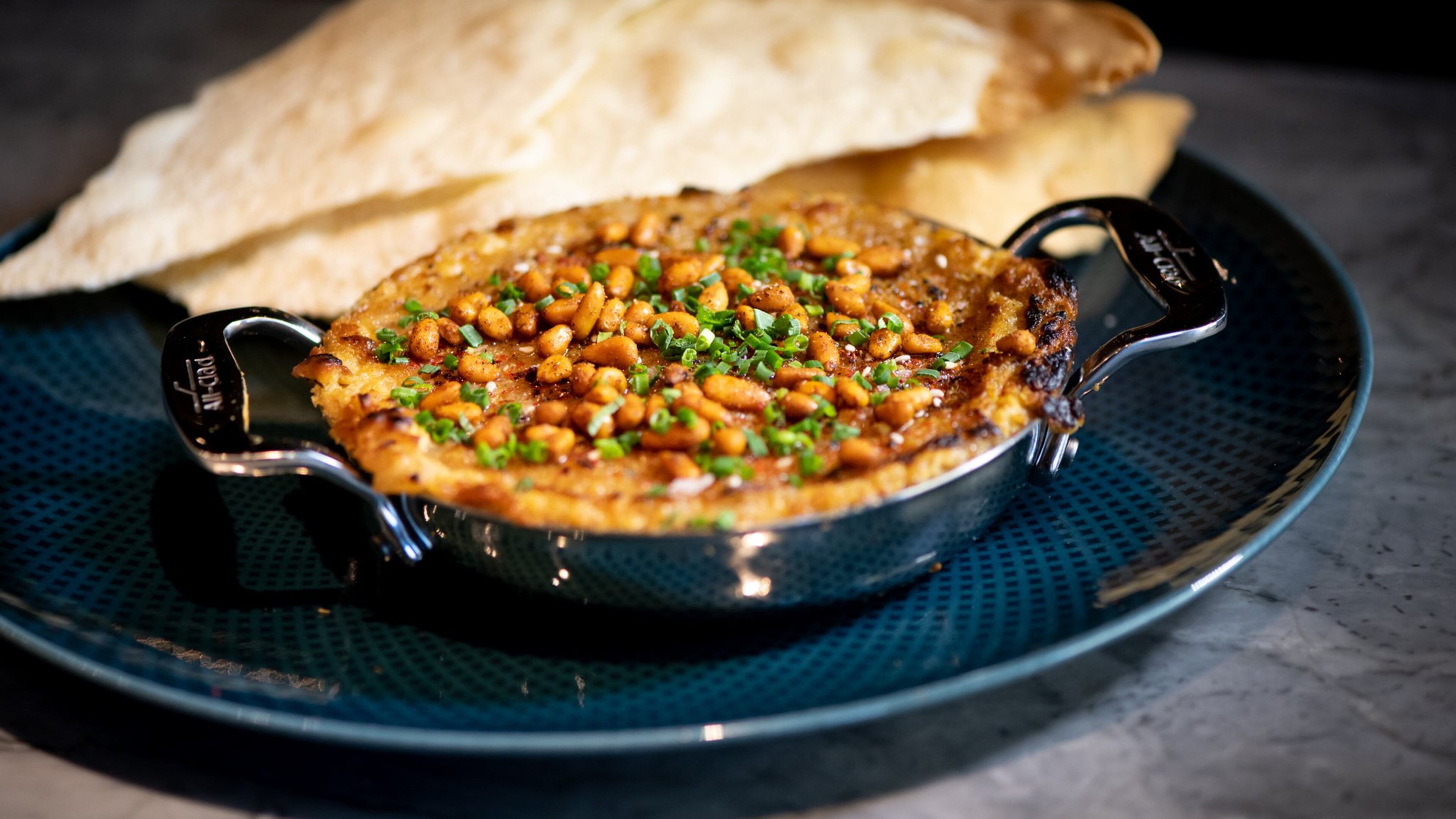 Wood-Fired Hummus with charred sweet onion, toasted pine nuts and lavash.
Mia Yakel for The Atlanta Journal-Constitution