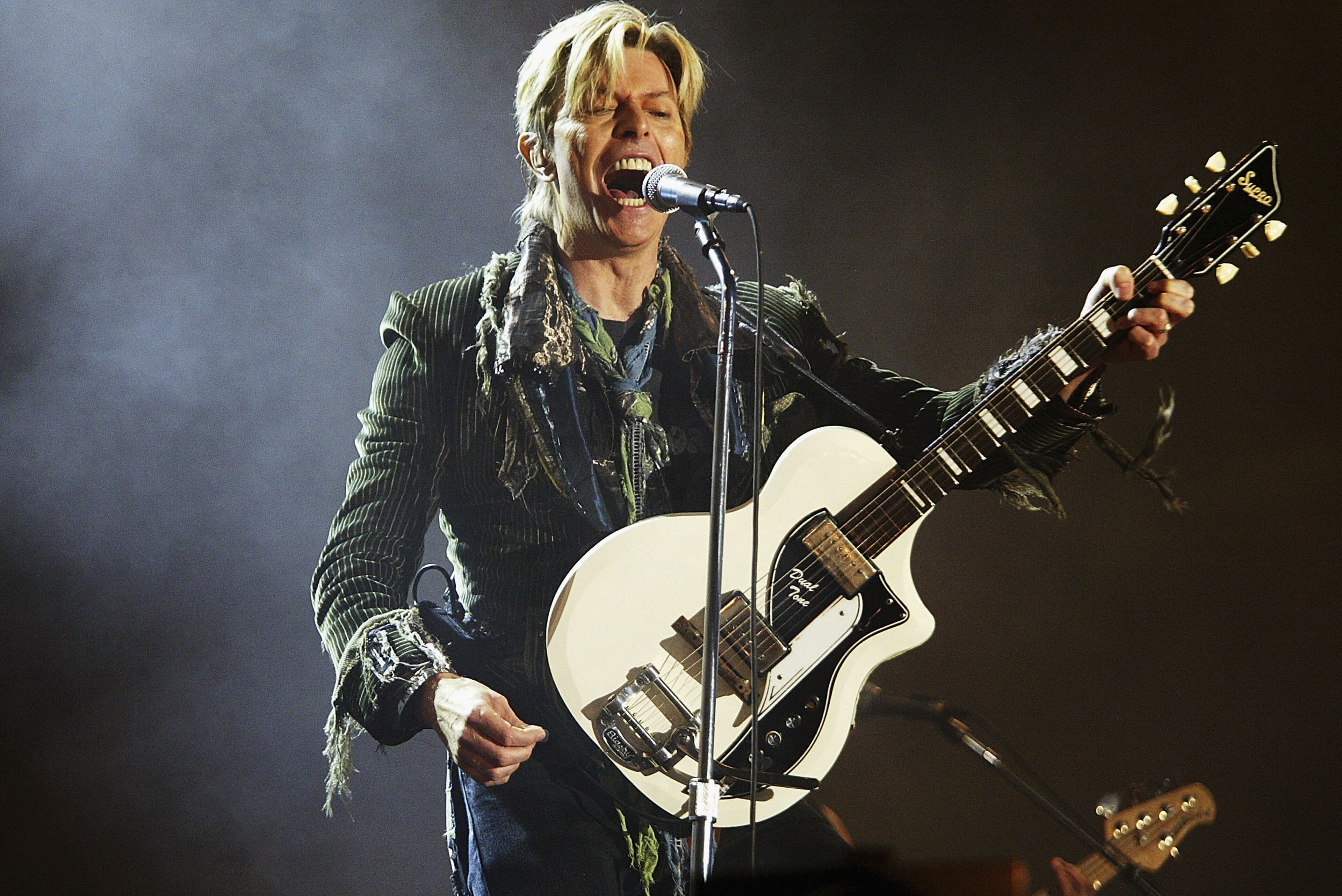 David Bowie performs on stage on the third and final day of "The Nokia Isle of Wight Festival 2004" at Seaclose Park, on June 13, 2004 in Newport, UK. The third annual rock festival takes place during the Isle of Wight Festival which runs from June 4-19.