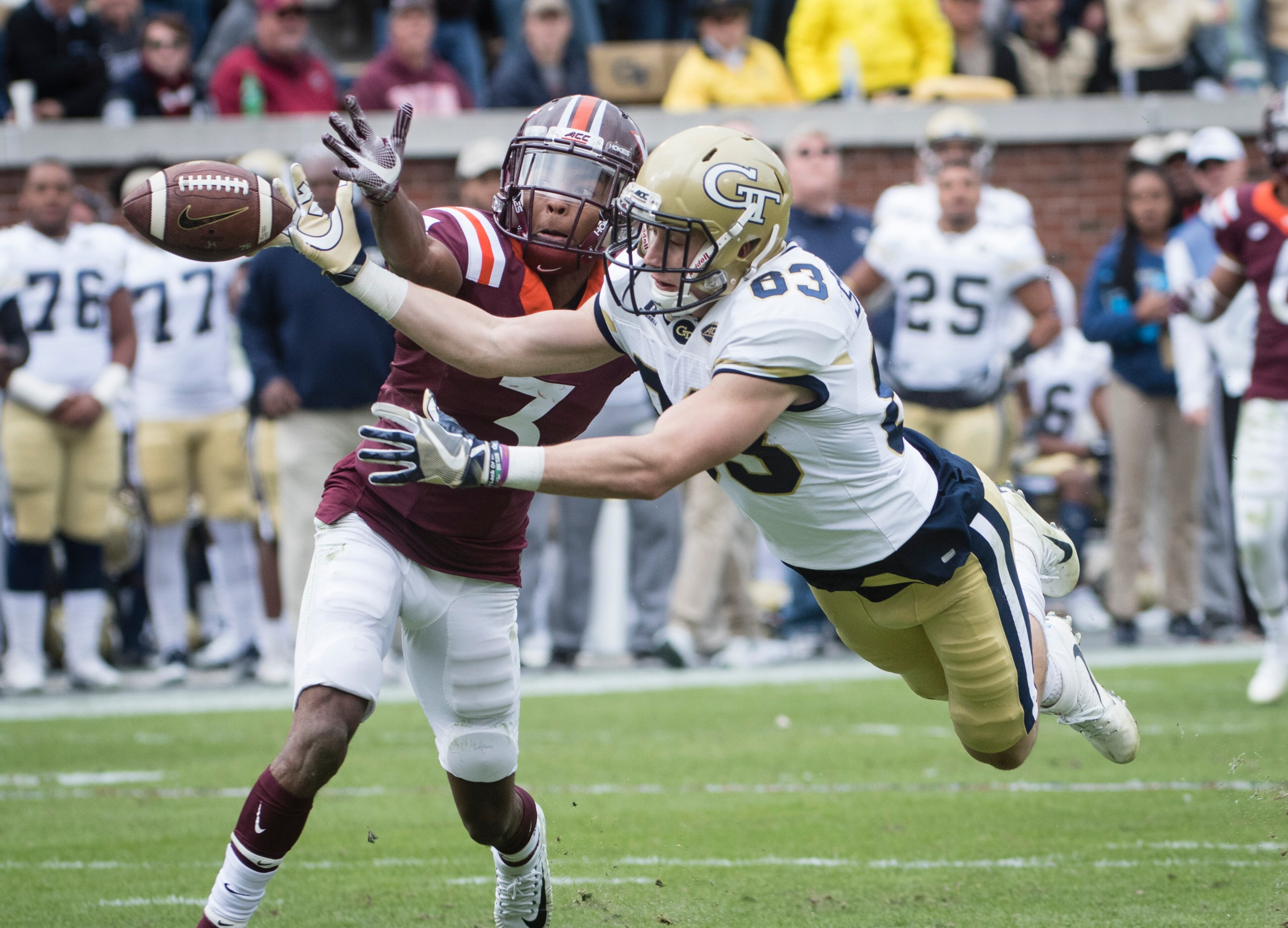 Georgia Tech wide receiver Brad Stewart (83) and Virginia Tech cornerback Greg Stroman (3) vie to catch a pass during the first half of a football game on Saturday, Nov.11, 2017, in Atlanta. (Photo/John Amis)