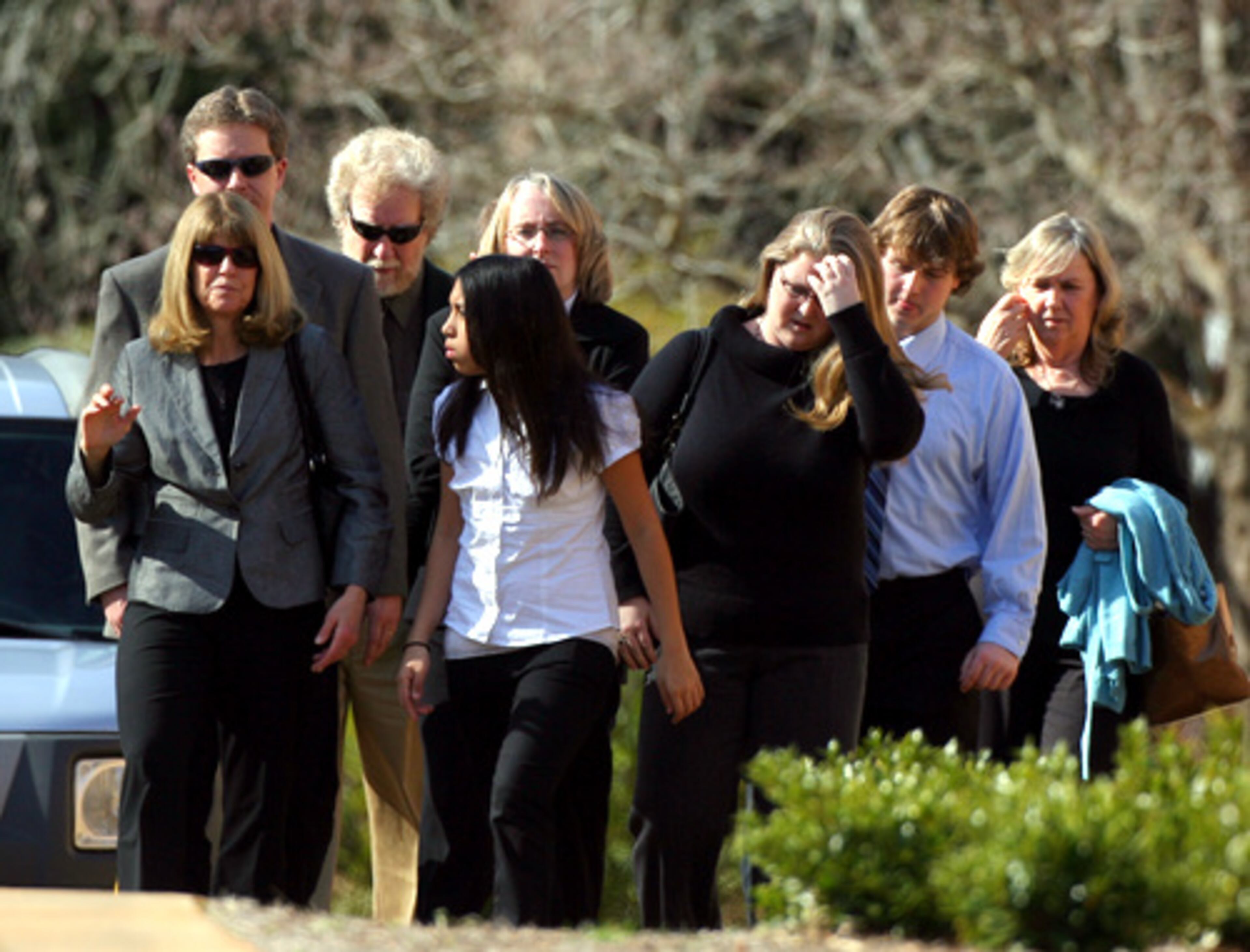 Family and friends of Meredith Emerson walk to the memorial service for her Friday at Center Presbyterian Church in Athens.