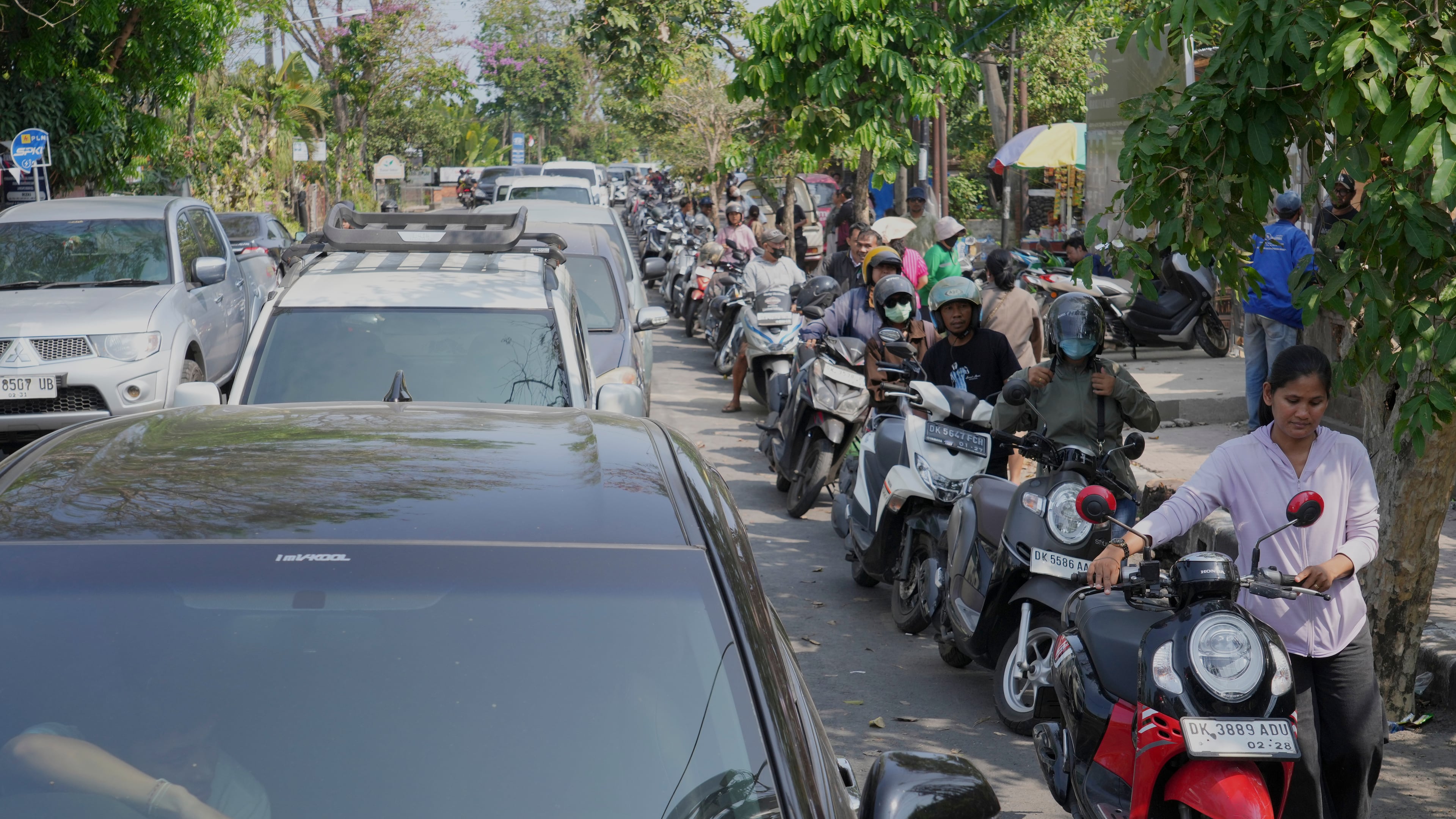 People queue at a gas station amid a fuel shortage in Denpasar, Bali, Indonesia, Wednesday, Oct. 14, 2026. (AP Photo/Firdia Lisnawati)