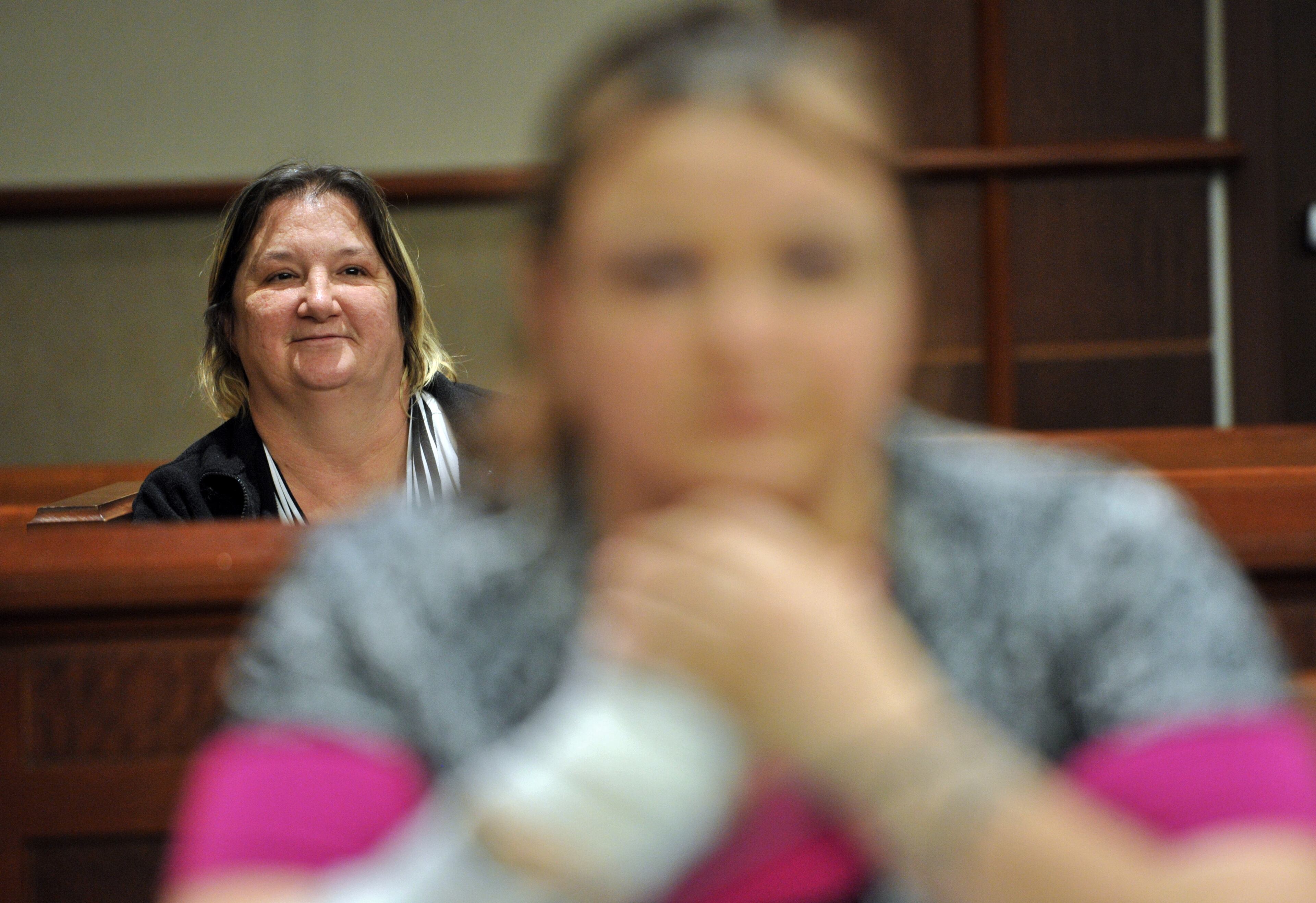 Sheila Sanders (background) watches her daughter Toshia Brown (foreground) during her session as a part of Douglas County Juvenile Court Family Treatment Program at Douglas County Juvenile Court in Douglasville. The family treatment program works with parents who have drug problems and have lost their children to foster care. They are encouraged to reunite with their children by seeking recovery from chemical dependency and by remaining drug free. HYOSUB SHIN / HSHIN@AJC.COM