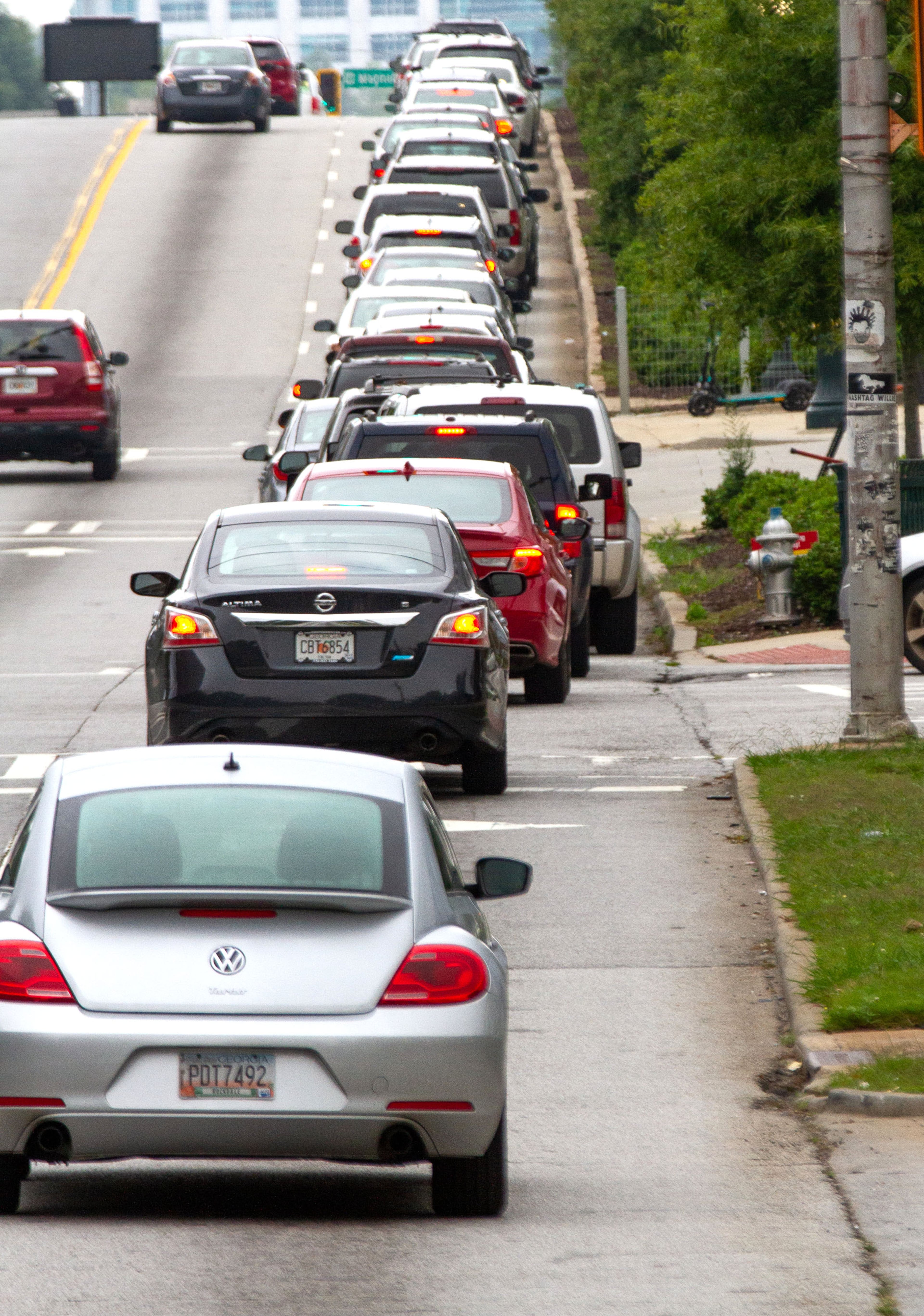 Cars line up before 9 am along Northside Drive to get into the Fuel the Vote food giveaway and voter registration drive at The Home Depot Backyard in Atlanta on Saturday, September 26, 2020. Sponsored by Michelle Obama's nonprofit organization When We All Vote , the event provided food and groceries to an estimated 2,500 attendees and helped them prepare to cast their ballots in November. STEVE SCHAEFER / SPECIAL TO THE AJC