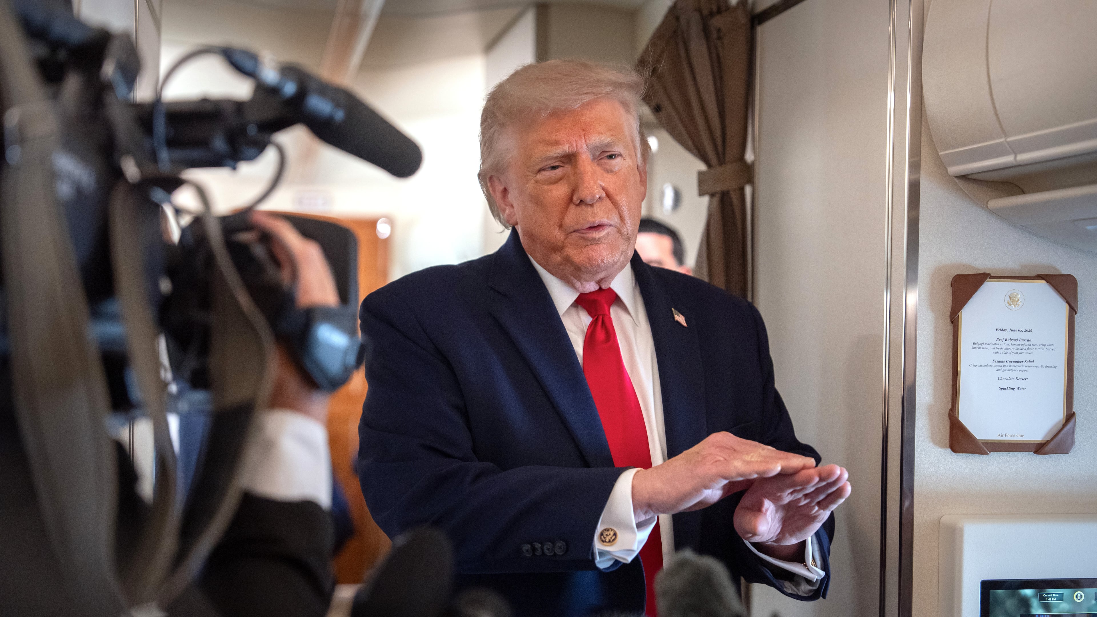 President Donald Trump speaks to reporters aboard Air Force One en route from Joint Base Andrews, Md., to Eau Claire, Wis., Friday, June 5, 2026. (AP Photo/Mark Schiefelbein)