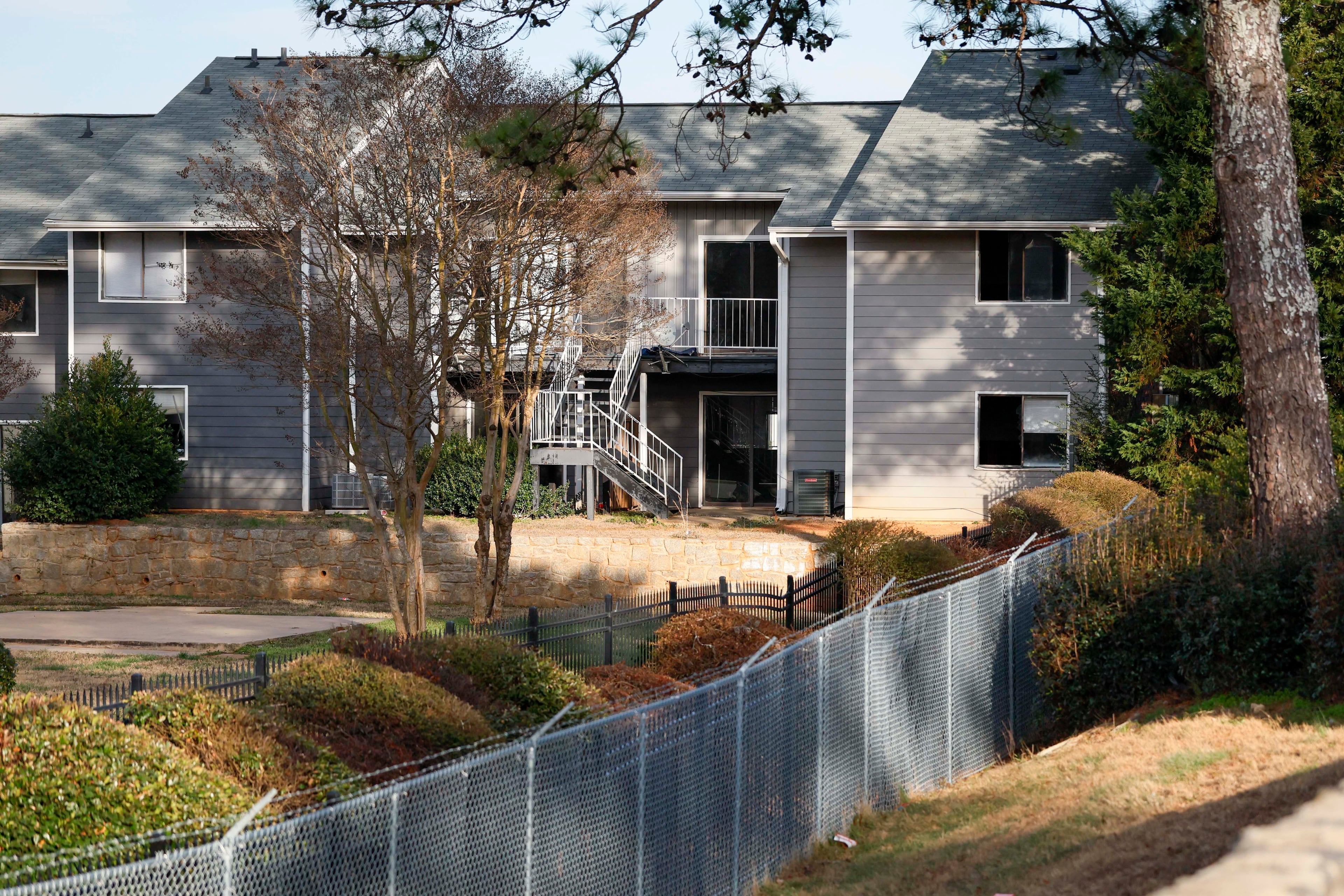There was a grand opening for the Ivy at College Park in November, but a fence prevents people from entering the complex formerly known as Chelsea Gardens and it's unclear when new tenants will move in. (Miguel Martinez/AJC)