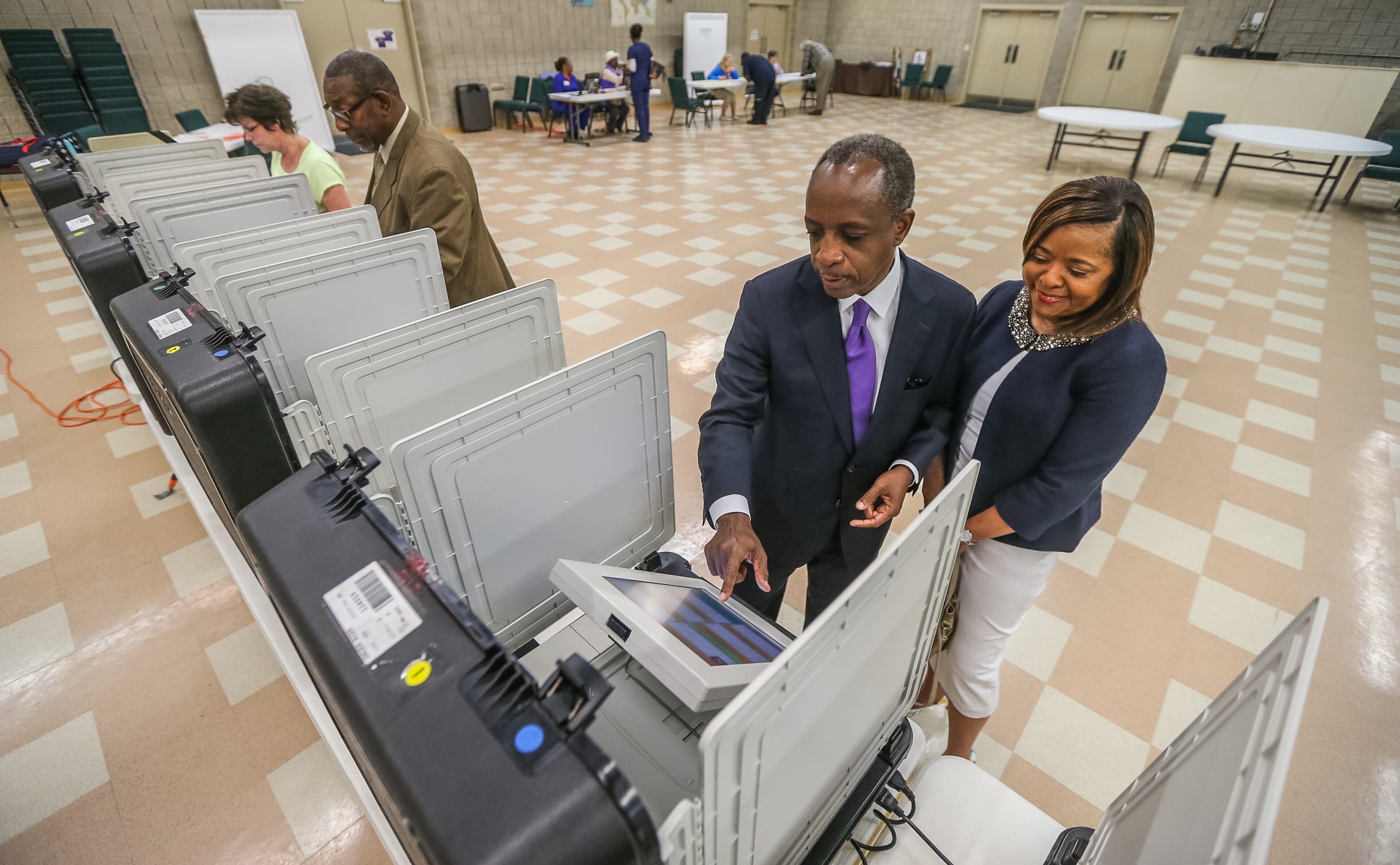 Michael and Zola Thurmond vote at Mt. Carmel Church on Tuesday, May 24, 2016, in the primary. A few voting booths down from Thurmond, Dr. R. Stephen Green, DeKalb schools superintendent casts his ballot.