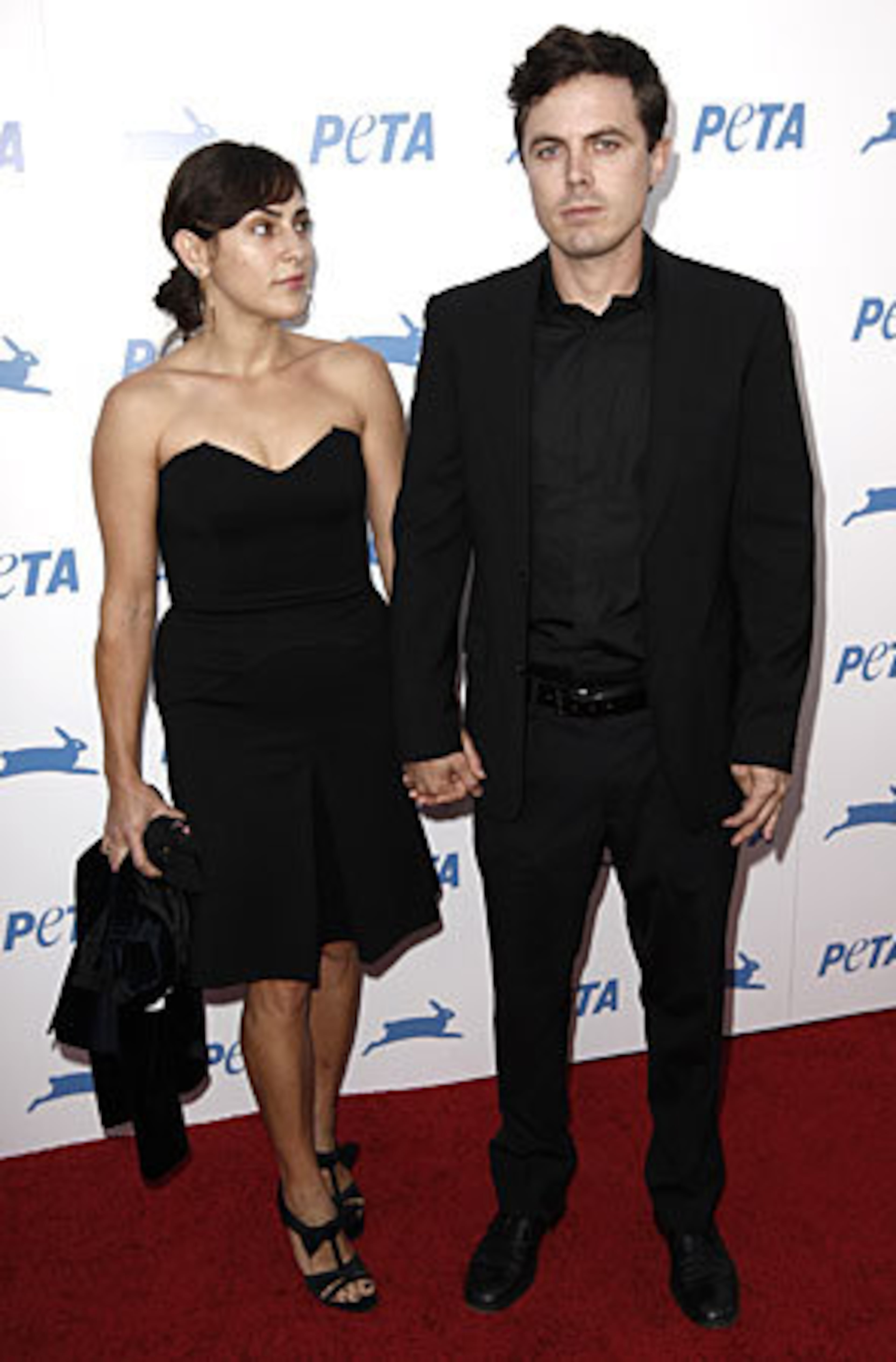 Casey Affleck, right, and his wife, Summer Phoenix.