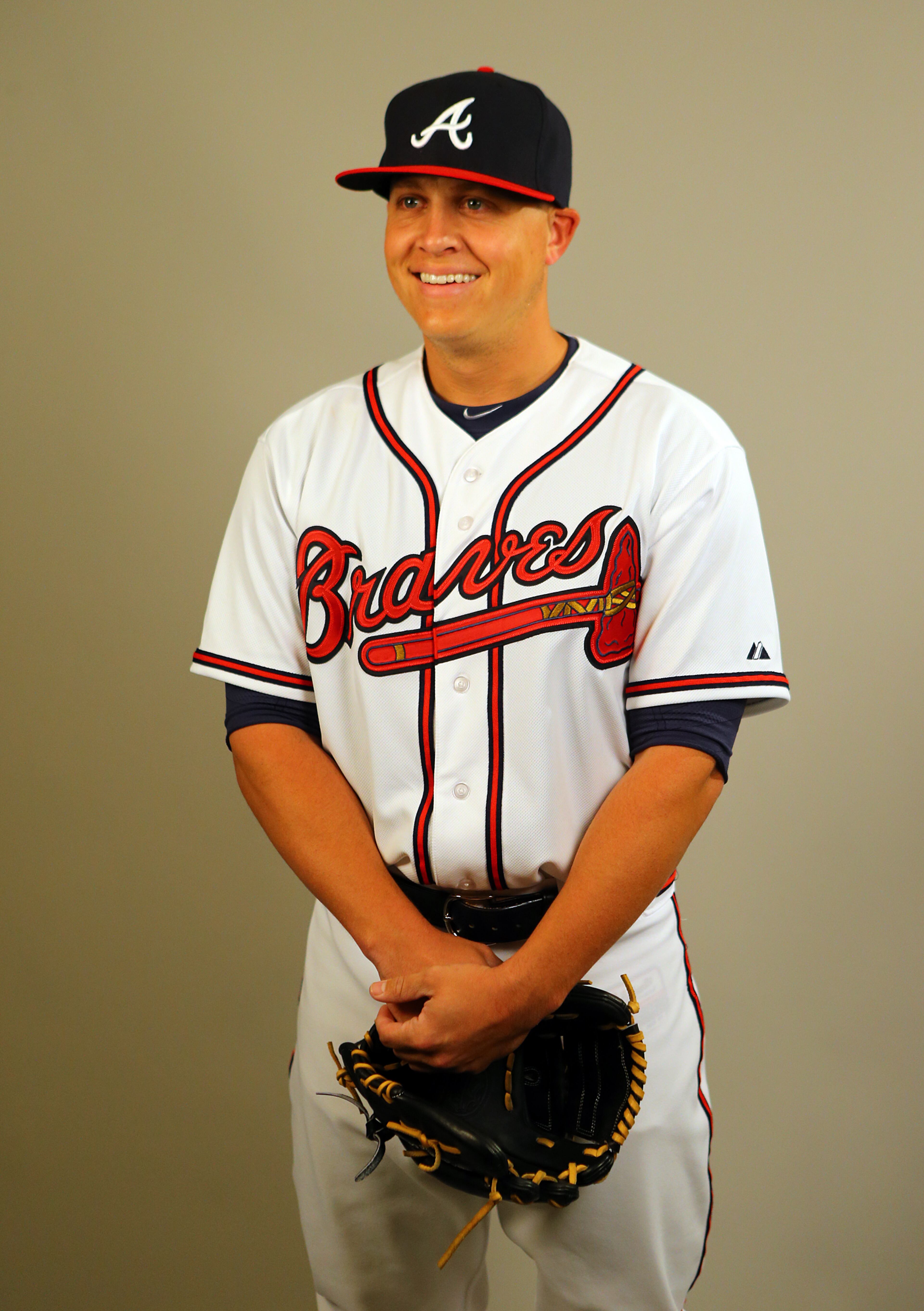 Braves right handed pitcher Kris Medlen begins to laugh during a video at Braves Media Day during spring training on Monday, Feb. 24, 2014, in Lake Buena Vista, FL.