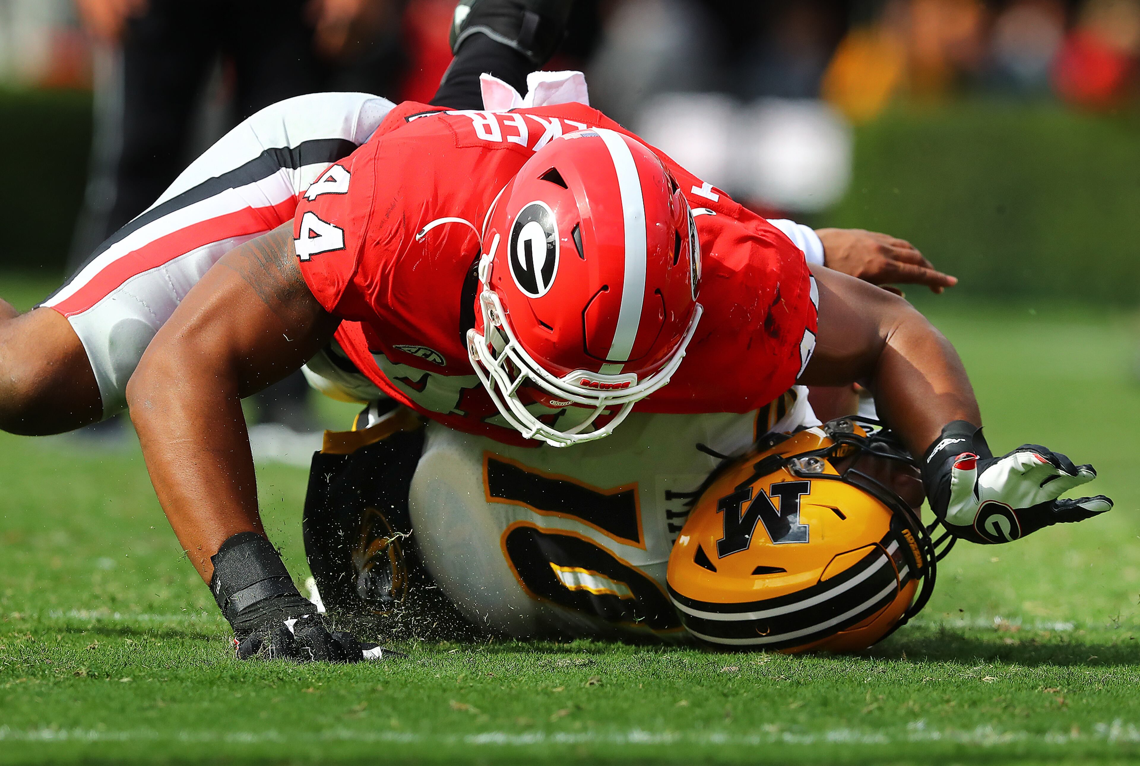 Georgia defensive lineman Travon Walker sacks Missouri quarterback Tyler Macon planting him in the grass during the third quarter in a NCAA college football game on Saturday, Nov. 6, 2021, in Athens. “Curtis Compton / Curtis.Compton@ajc.com”