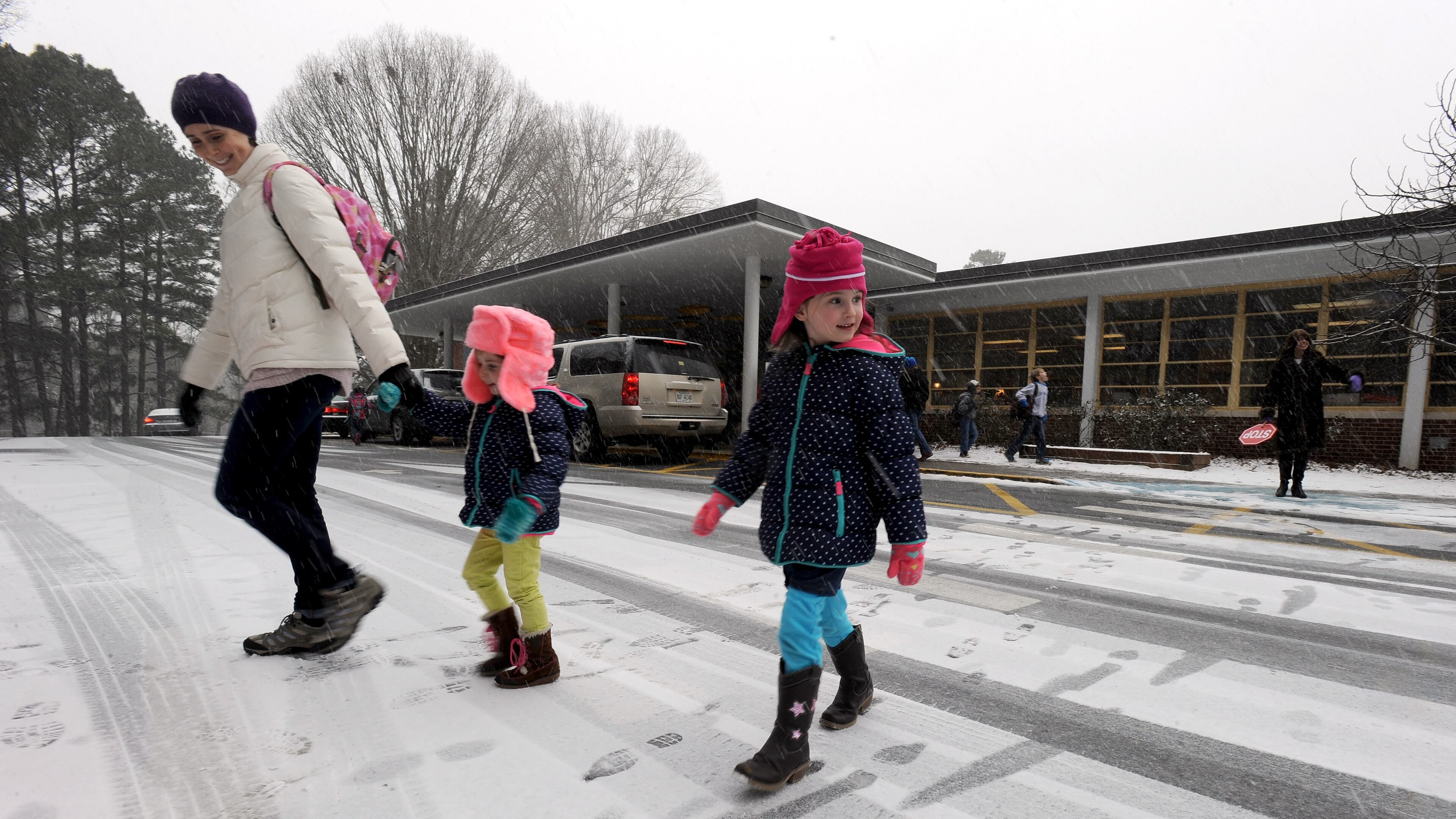 Sagamore Hills Elementary School students in DeKalb County leave school early as a major winter storm dumps 1 to 3 inches of snow on Georgia and the metro Atlanta area on January 28, 2014.