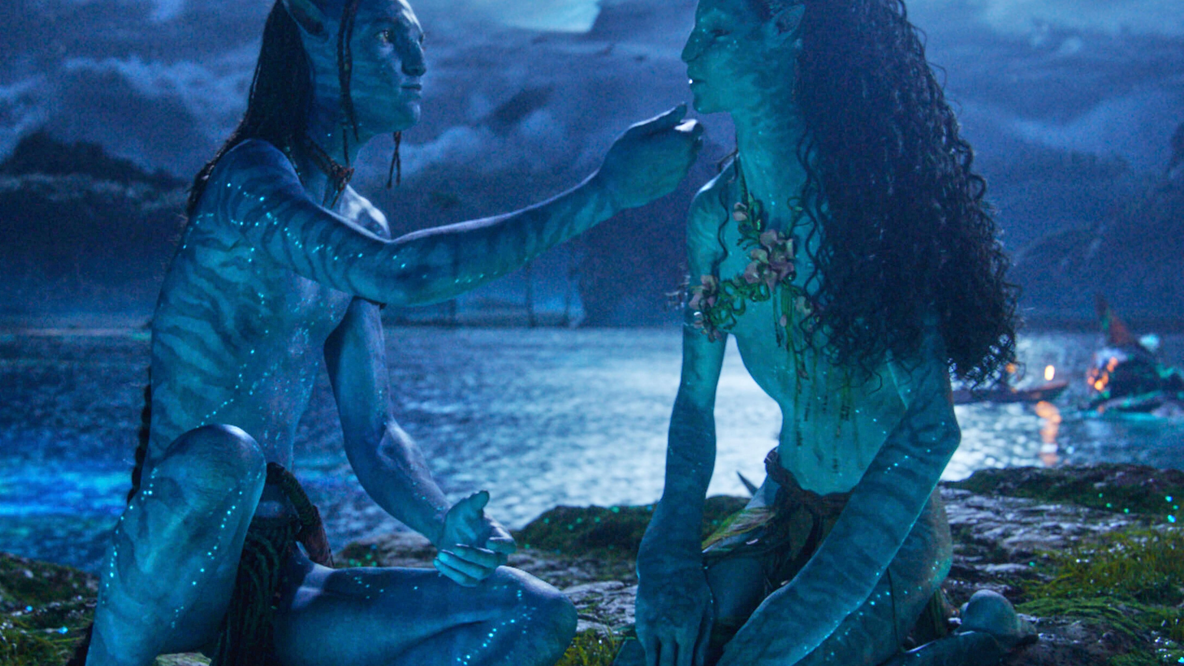 This image released by Disney shows Lo'ak, performed by Britain Dalton, left, and Tsireya, performed by Bailey Bass in a scene from "Avatar: Fire and Ash." (20th Century Studios/Disney via AP)