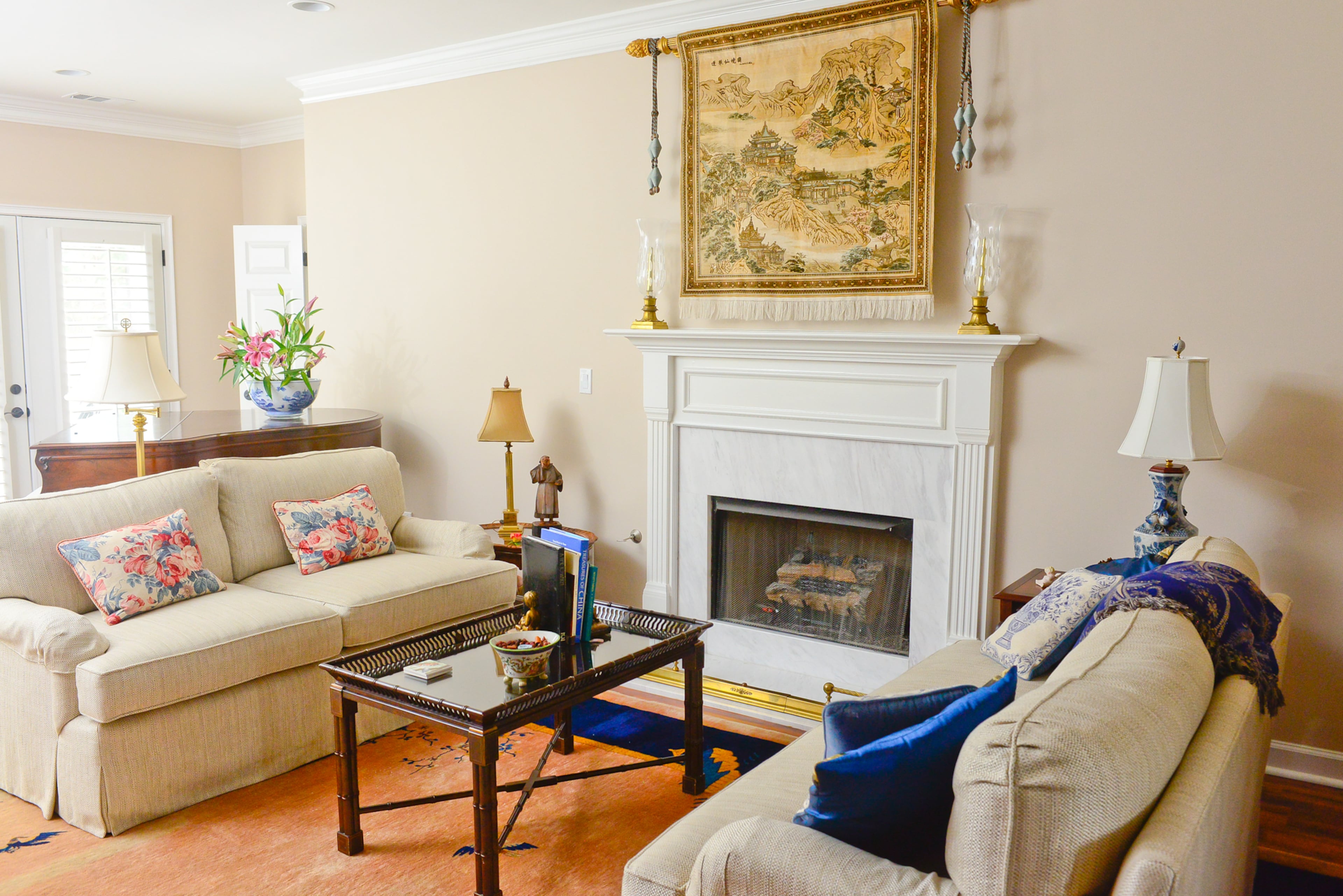 Linda and Chris Clark downsized from an 8,500-square-foot house to their 2,000-square-foot Stone Mountain home in 2015. In doing so, they found they needed smaller furniture for some of their spaces. They consulted their designer friend Linda Thomas and chose two sofas with down-filled cushions for the living room.
