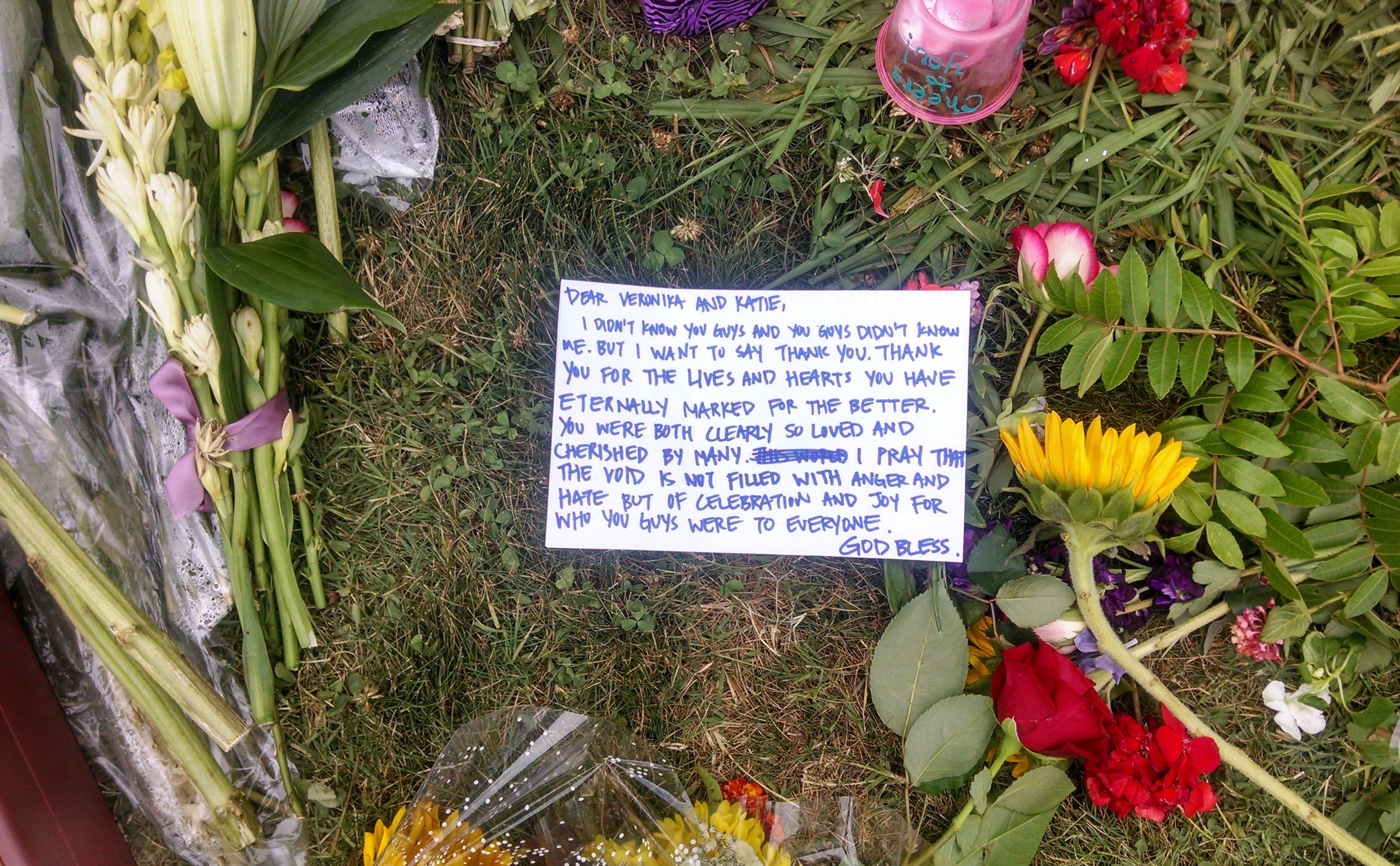 A sidewalk memorial includes a note addressed to Katie Cooper and Veronica Weiss, two of the victims of a shooting rampage by Elliott Rodger, outside the Delta Phi sorority house, in the Isla Vista neighborhood of Goleta, Calif., Monday, May 26, 2014. Six people, all students at nearby University of California, Santa Barbara, were killed before Rodger was killed by gunfire in the 10-minute rampage Friday, May 23. (AP Photo/Christopher Weber)