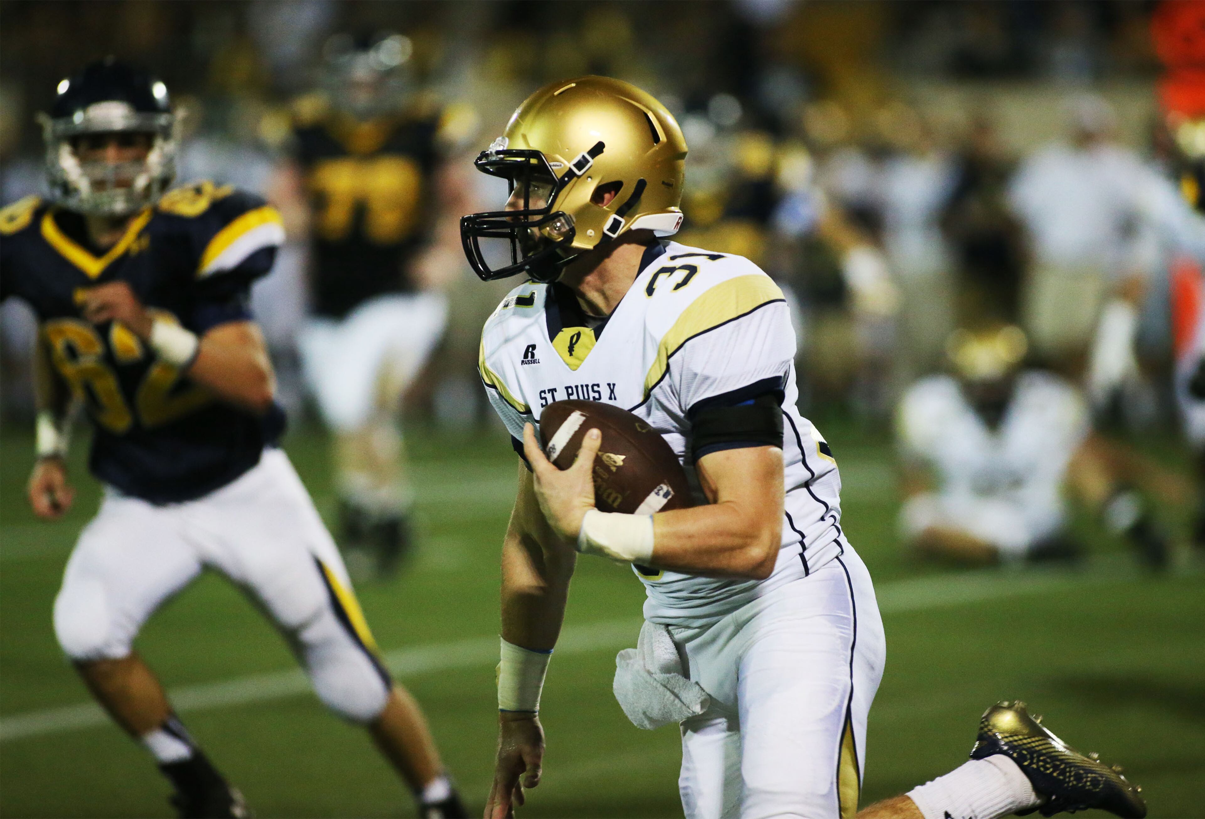 St. Pius' Ransom Klinger runs the ball during first half action against Marist at Hughes Spalding Stadium in Atlanta on Friday, October 10, 2014. (Photo by Phil Skinner)