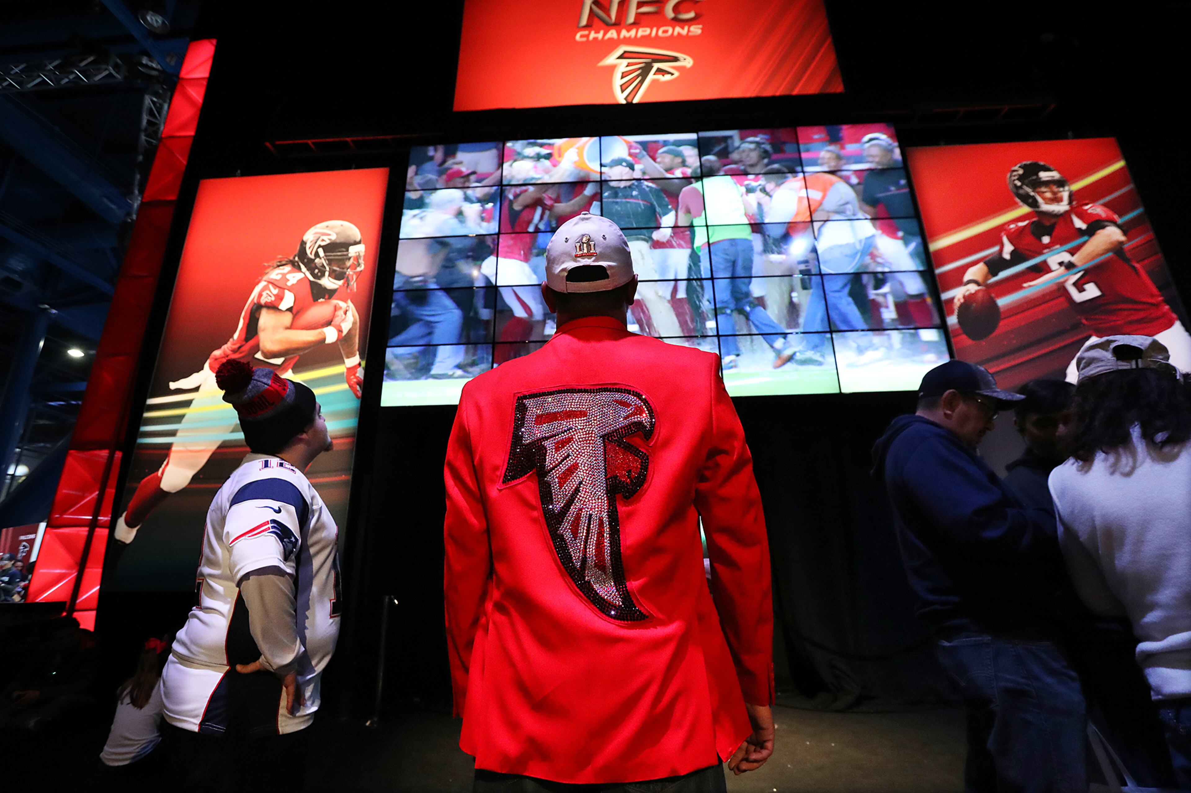 February 4, 2017, Houston: Ash Patel, Savannah, sports a Falcons coat he had made while taking in the Falcons display at the NFL Experience on Saturday Feb. 4, 2017, in Houston. Curtis Compton/ccompton@ajc.com
