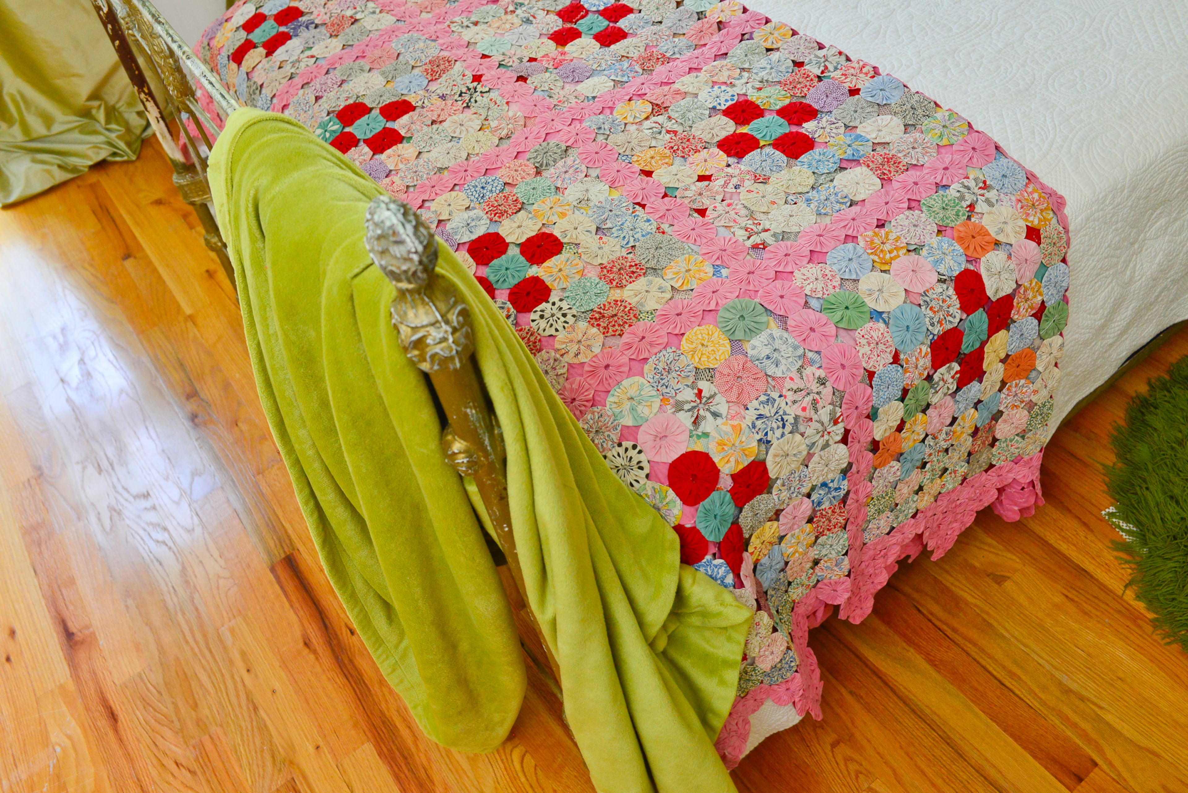 Guest bedroom: The "yo-yo" coverlet is a vintage piece and family heirloom now belonging to homeowner Dena Stormer.